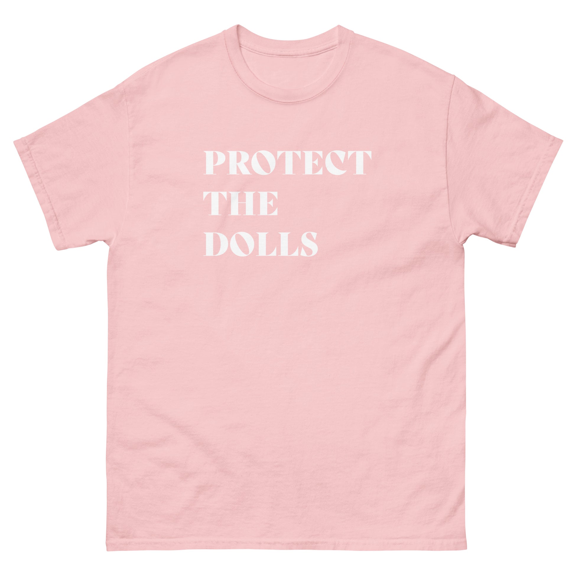 Light pink unisex classic t-shirt featuring bold white serif typography reading “Protect The Dolls.”