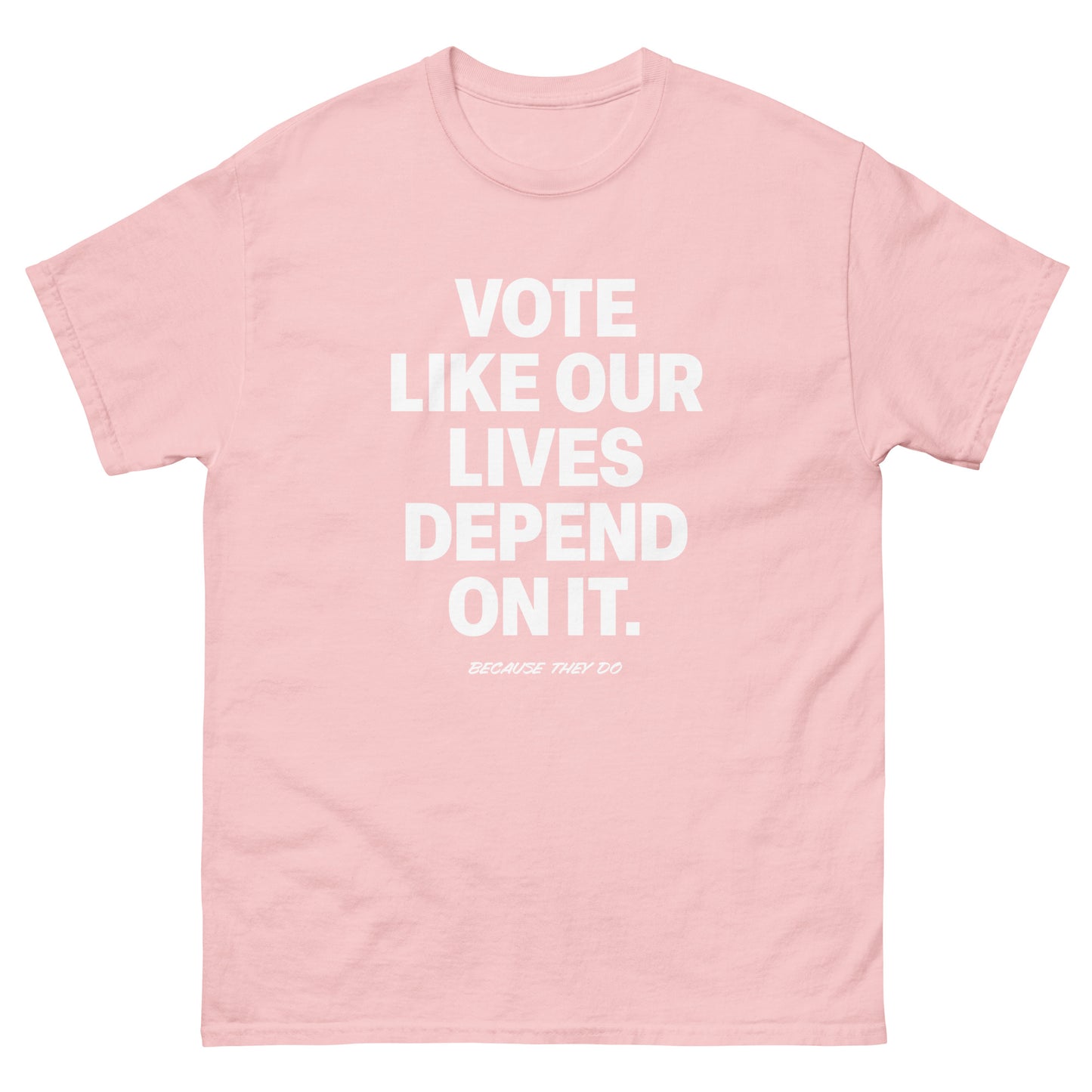 Soft pink unisex t-shirt featuring bold voting statement in minimalist white lettering.