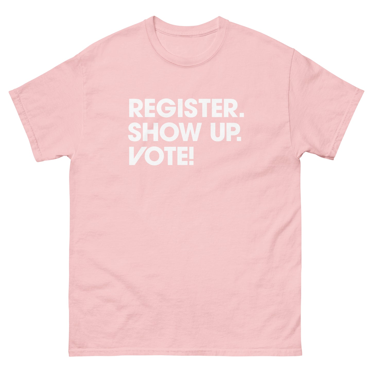 Soft pink unisex classic tee displaying civic engagement slogan encouraging registration and voting printed across chest.