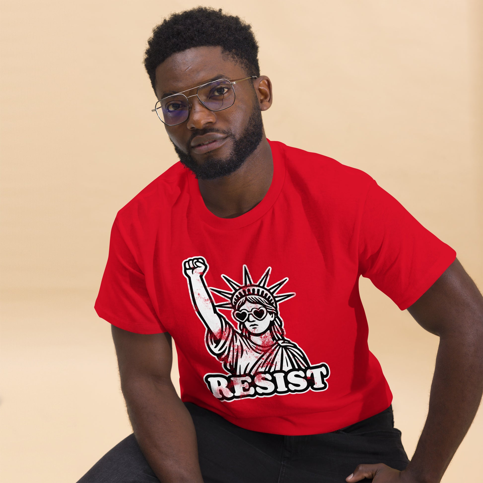 Lifestyle Image: Black male protester wearing Statue of Liberty protest tee - red