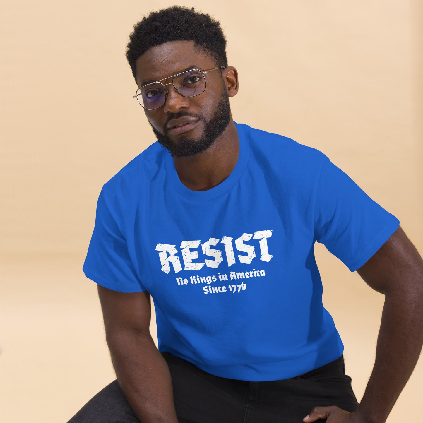 Lifestyle Image: Black Protester wearing shirt at rally with sign or flag