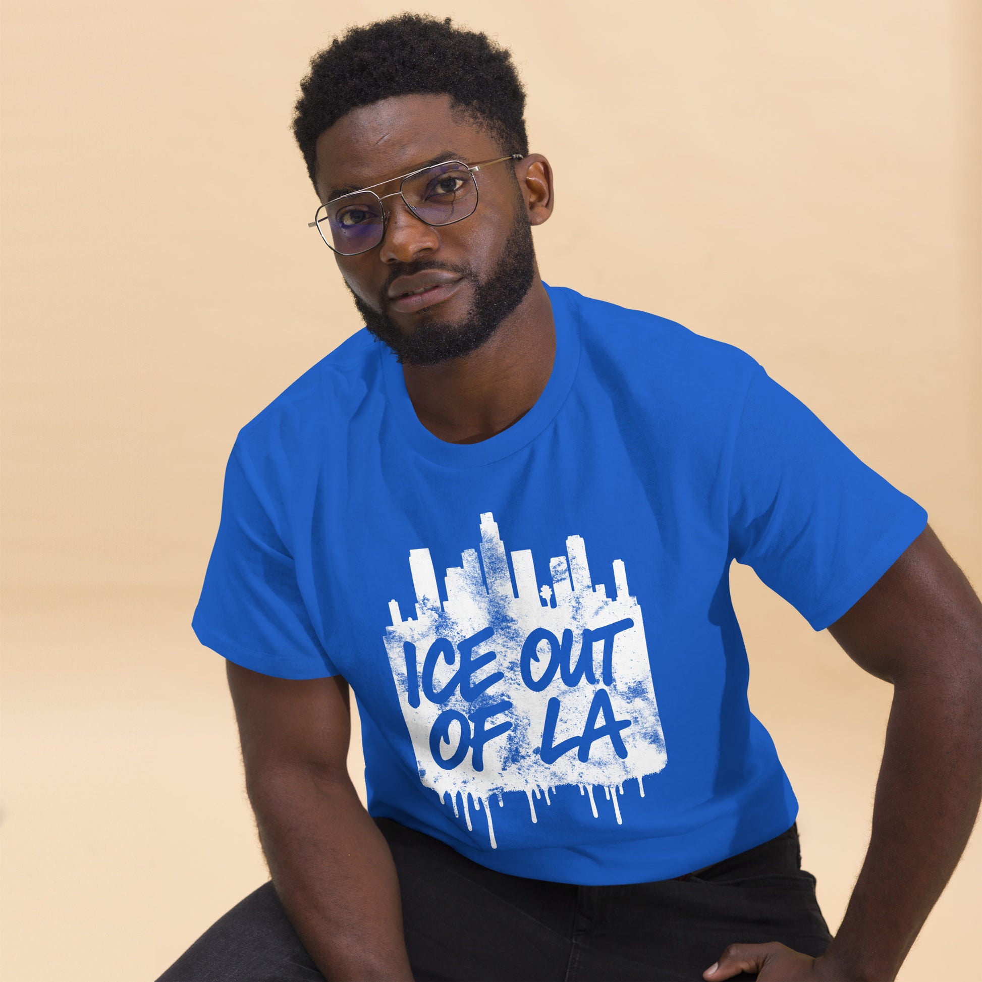 Lifestyle Image: Black male Activist wearing ICE OUT OF LA anti-deportation LA streetwear shirt