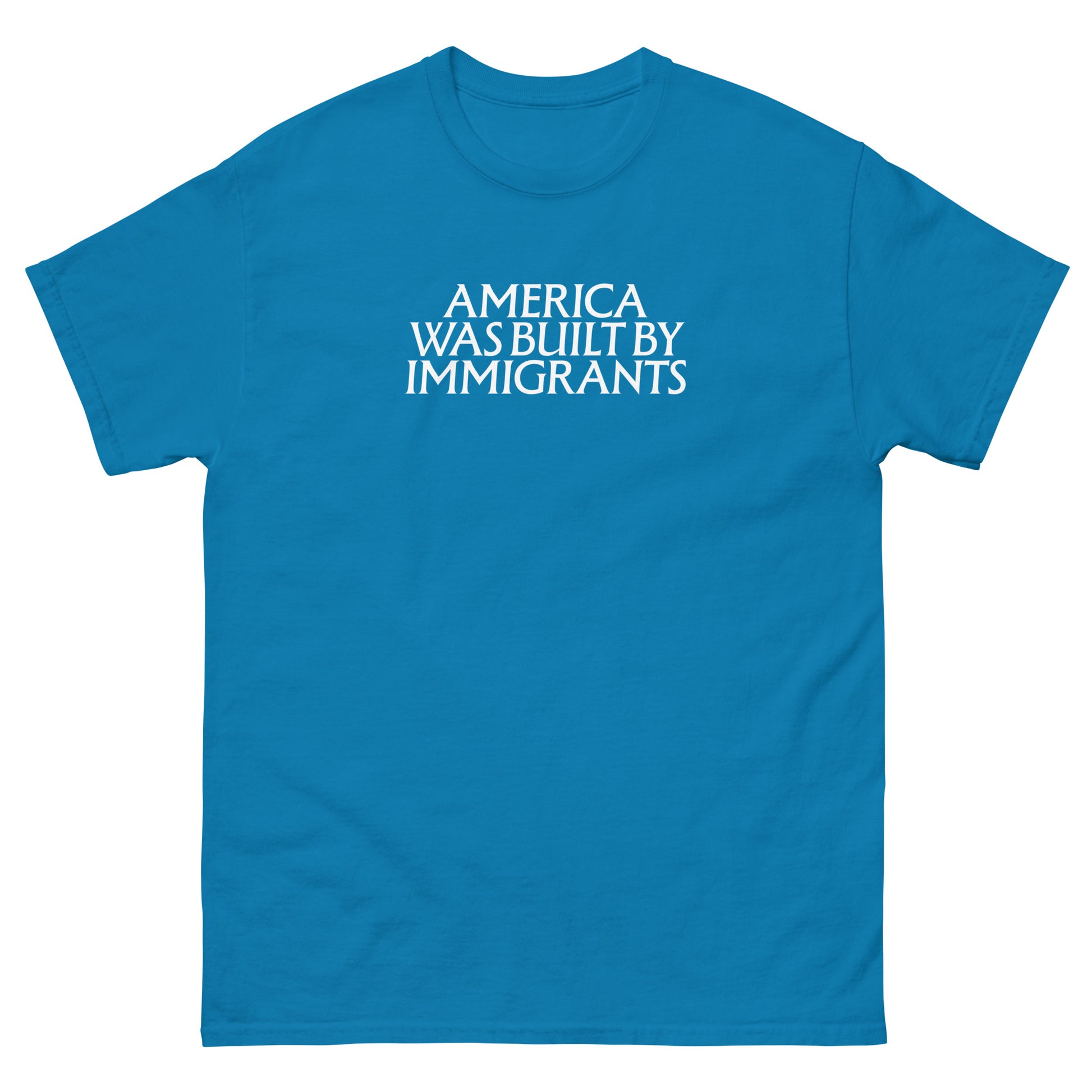 Teal unisex embroidered t-shirt with small chest text in clean serif lettering, minimalist pro-immigrant message stitched in white thread on soft cotton fabric.