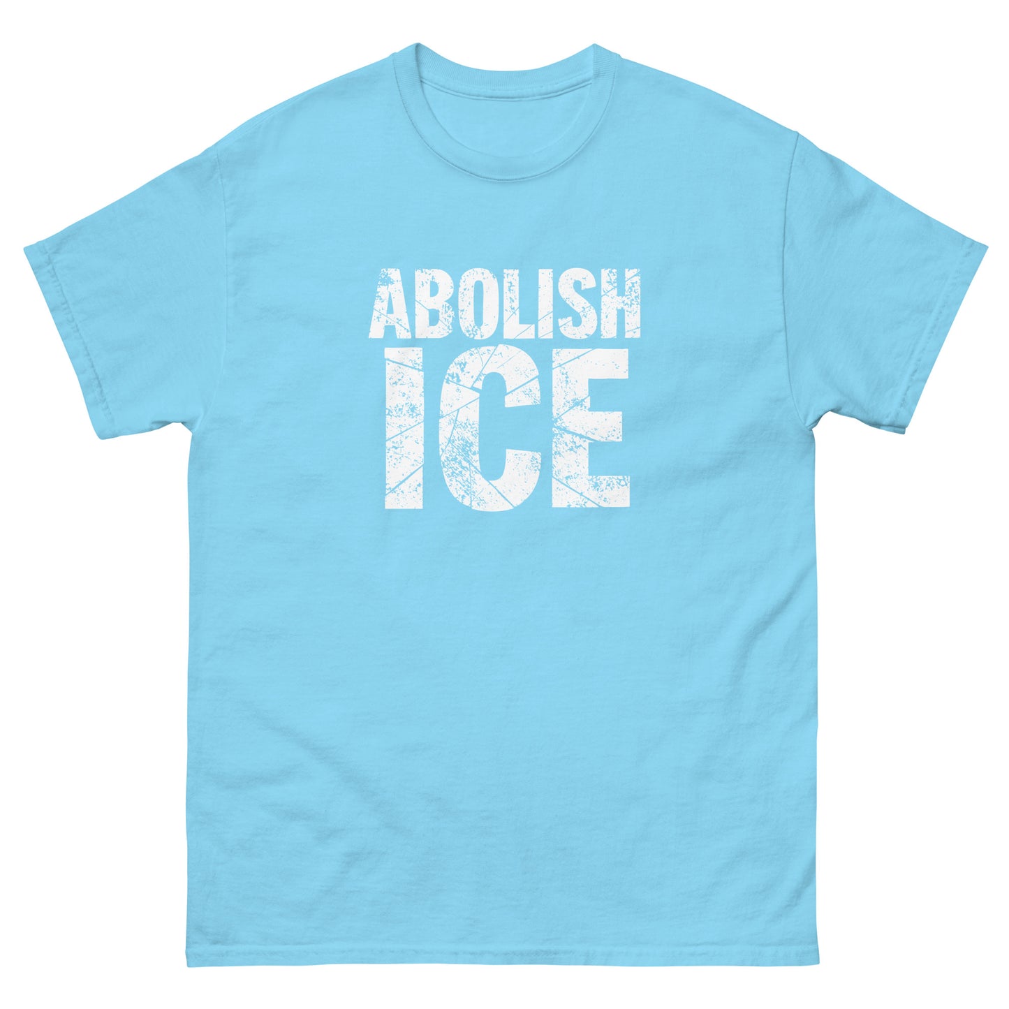 Light blue unisex classic t-shirt displaying distressed white block typography in a clean protest composition, minimal graphic style from Blue Wave USA.