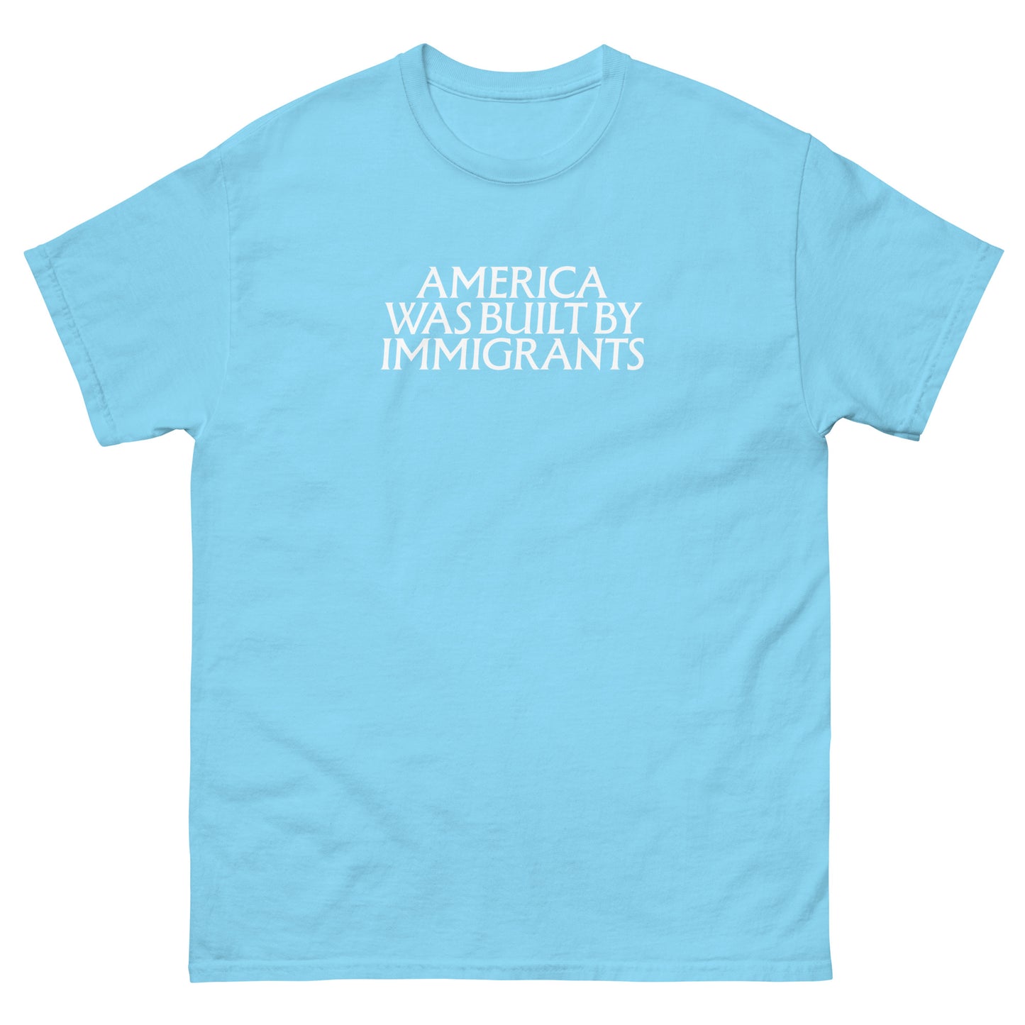 Light blue unisex embroidered t-shirt featuring subtle white chest text, minimalist typographic design with a pro-immigrant message.