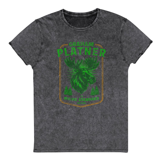 Charcoal black denim t-shirt featuring green moose graphic with “Graham Platner Maine Standard” text in vintage outdoor Maine-inspired design.