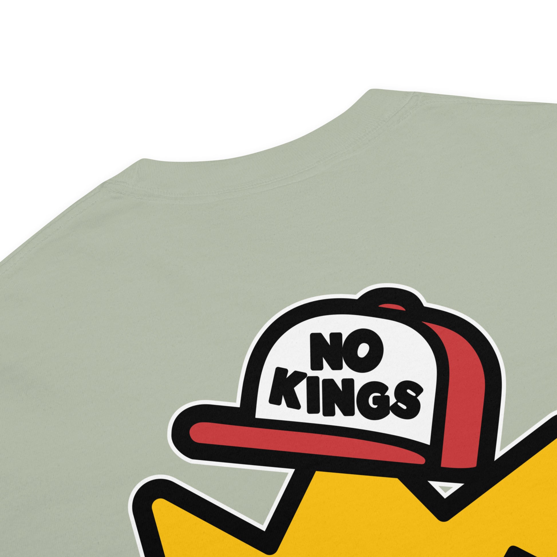 Close-up view of the cartoon crown wearing a “No Kings” trucker hat with X-shaped eyes, tongue-out expression, and thick black outlines.