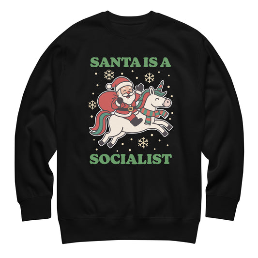 Black sweatshirt featuring a retro Santa riding a unicorn with holiday stars and the printed message “SANTA IS A SOCIALIST” in green lettering.