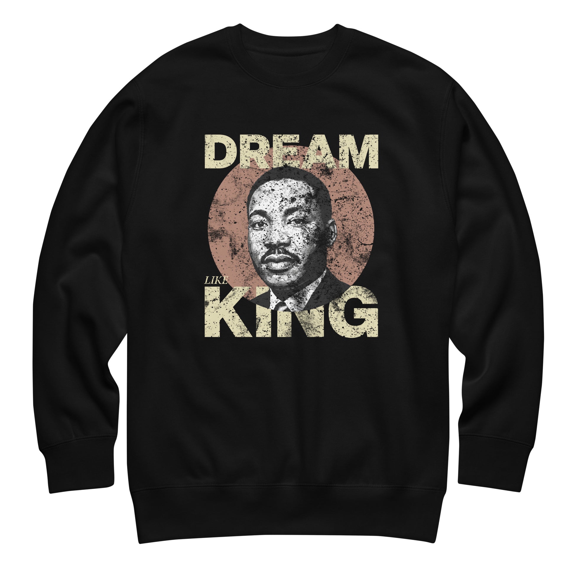 Black unisex premium sweatshirt featuring the distressed “DREAM LIKE KING” text with MLK’s portrait inside a textured circle. Vintage civil-rights inspired design from Blue Wave USA.