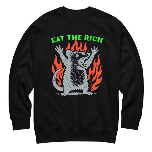 Black unisex premium sweatshirt featuring flaming opossum illustration with bold green text reading “Eat The Rich,” anti-capitalist protest apparel from Blue Wave USA.