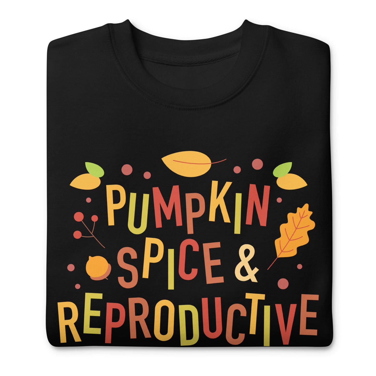 Folded black premium sweatshirt showing illustrated autumn typography reading “Pumpkin Spice & Reproductive Rights,” seasonal reproductive freedom activist apparel.