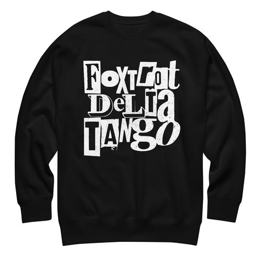 Black unisex premium sweatshirt featuring bold punk-style typography reading “FOXTROT DELTA TANGO” in distressed white lettering.