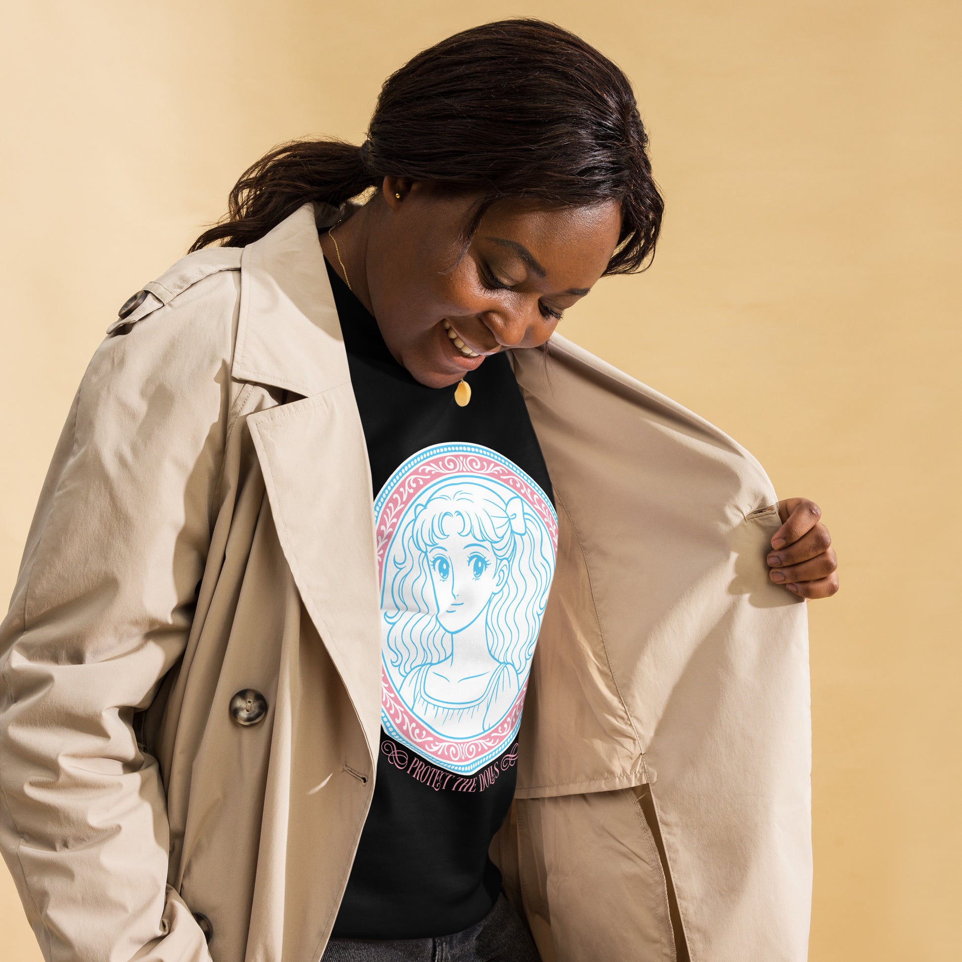 Lifestyle Image: Model wearing Protect The Dolls sweatshirt at a pride rally