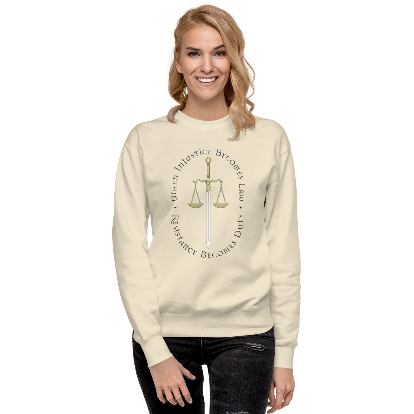 Model wearing cream unisex premium sweatshirt featuring Sword of Justice and scales illustration, progressive social justice apparel from Blue Wave USA.