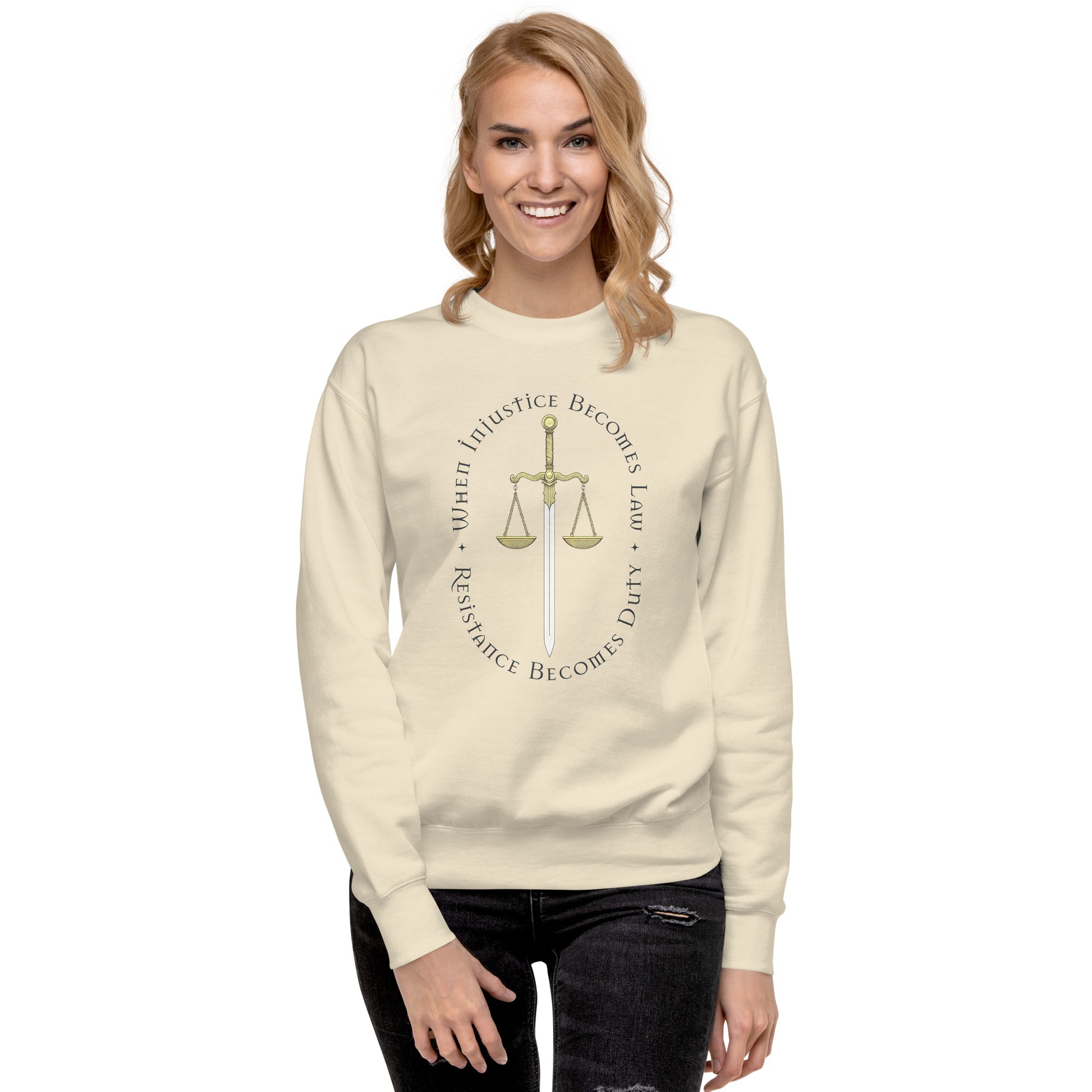 Model wearing cream unisex premium sweatshirt featuring Sword of Justice and scales illustration, progressive social justice apparel from Blue Wave USA.