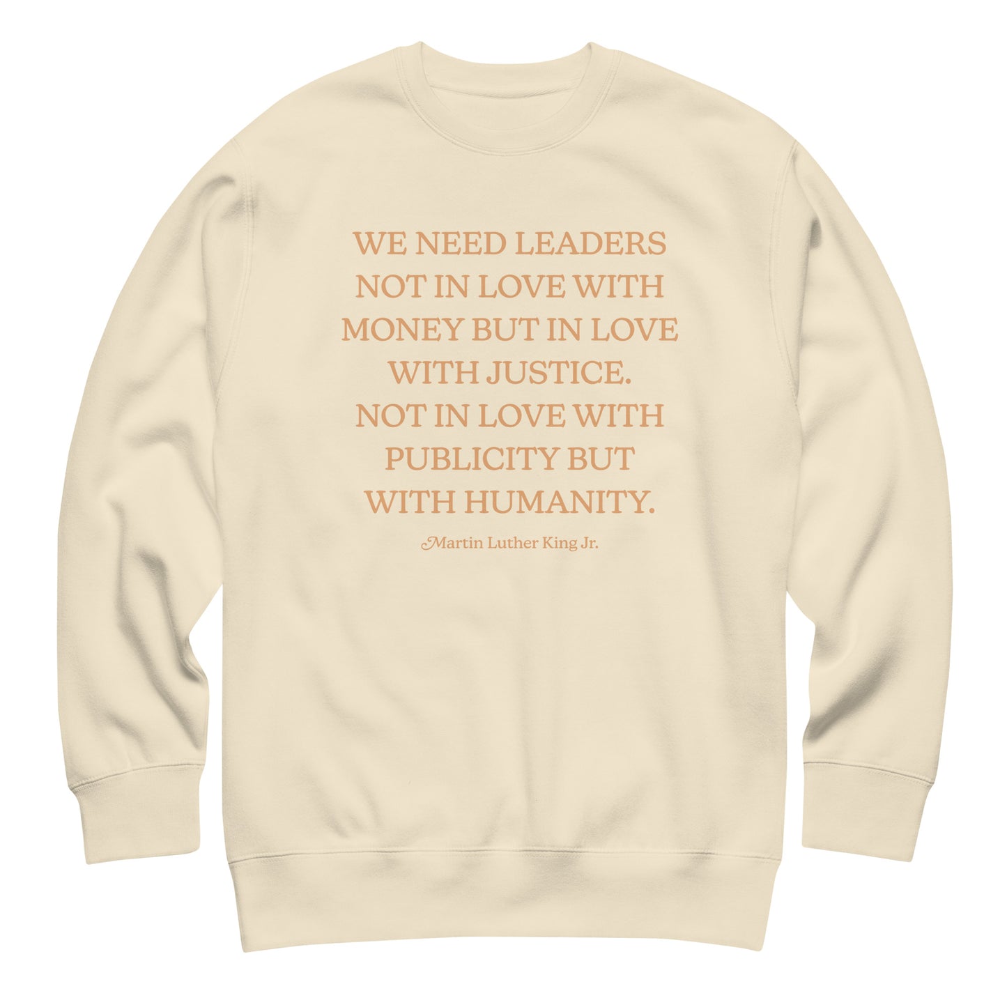 Cream unisex premium sweatshirt featuring MLK’s quote about leadership, justice, and humanity. A gentle, text-forward design suitable for civil-rights supporters.