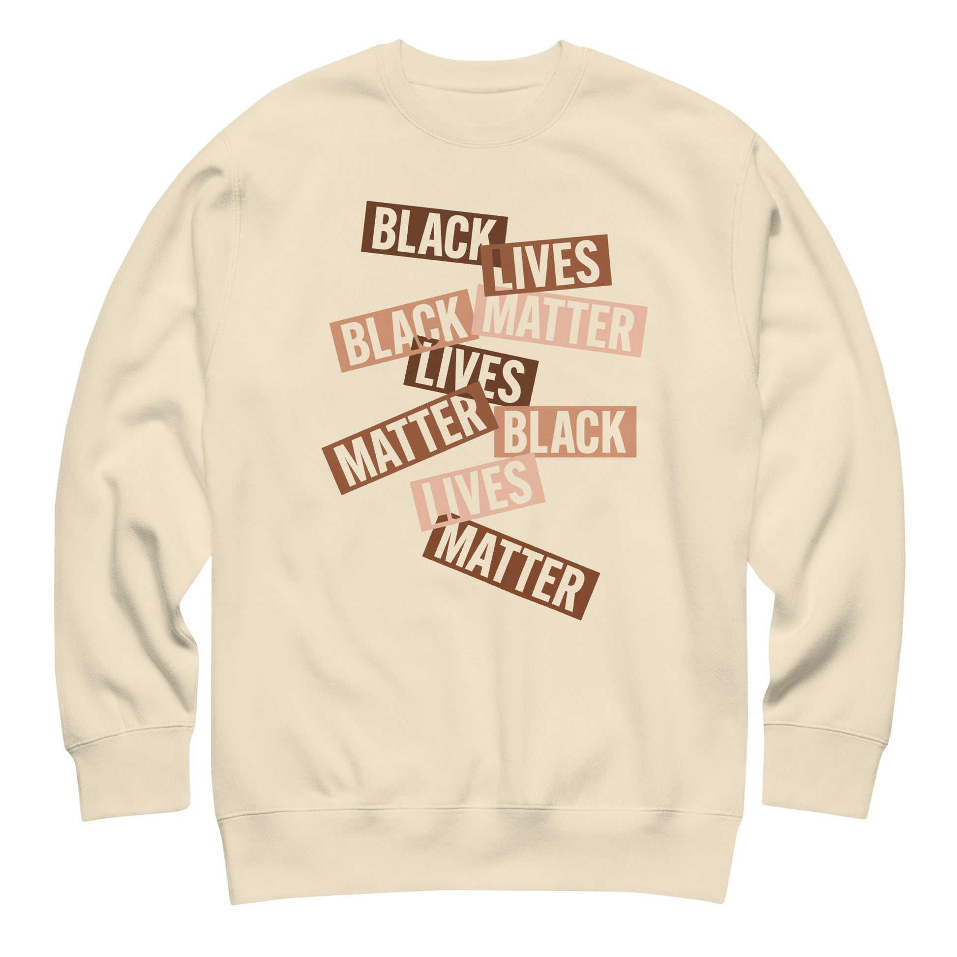 Cream sweatshirt showing layered brown cut-paper strips reading “BLACK LIVES MATTER.” A warm, soft-toned activist message.