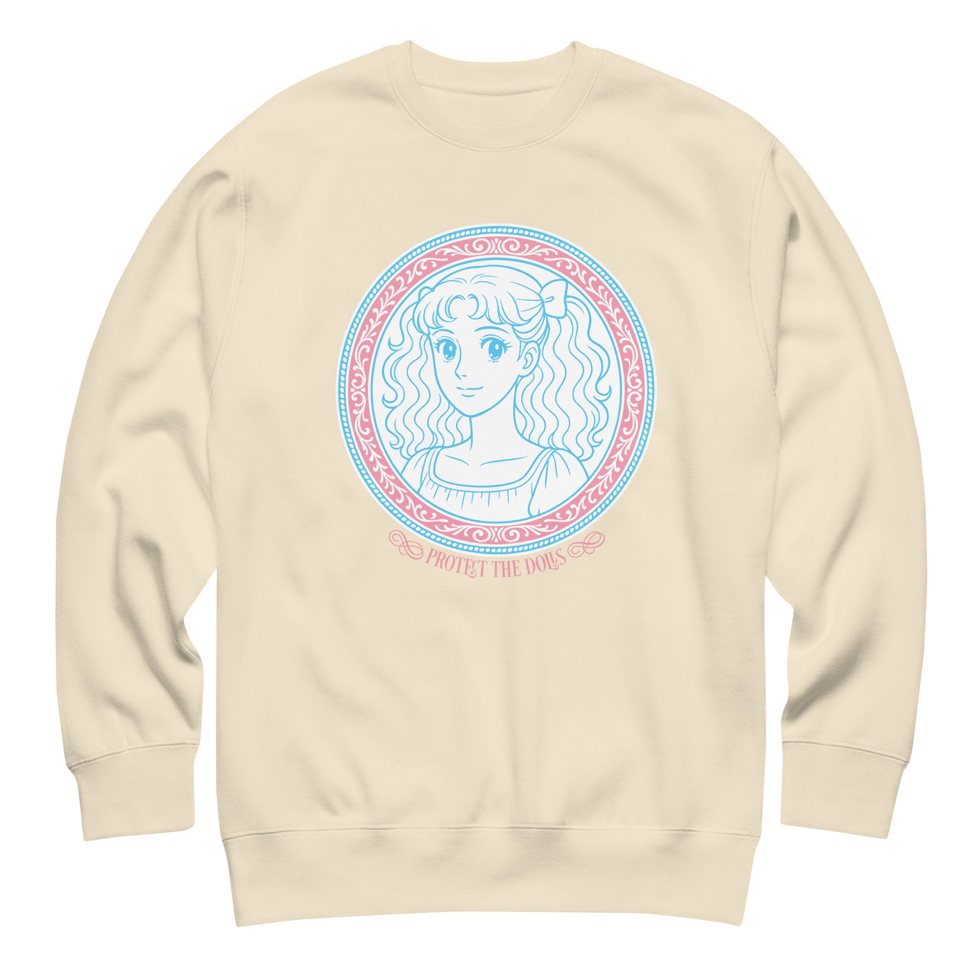 Cream unisex premium sweatshirt showcasing soft pastel portrait artwork framed in ornate circular border with the phrase “Protect The Dolls.”
