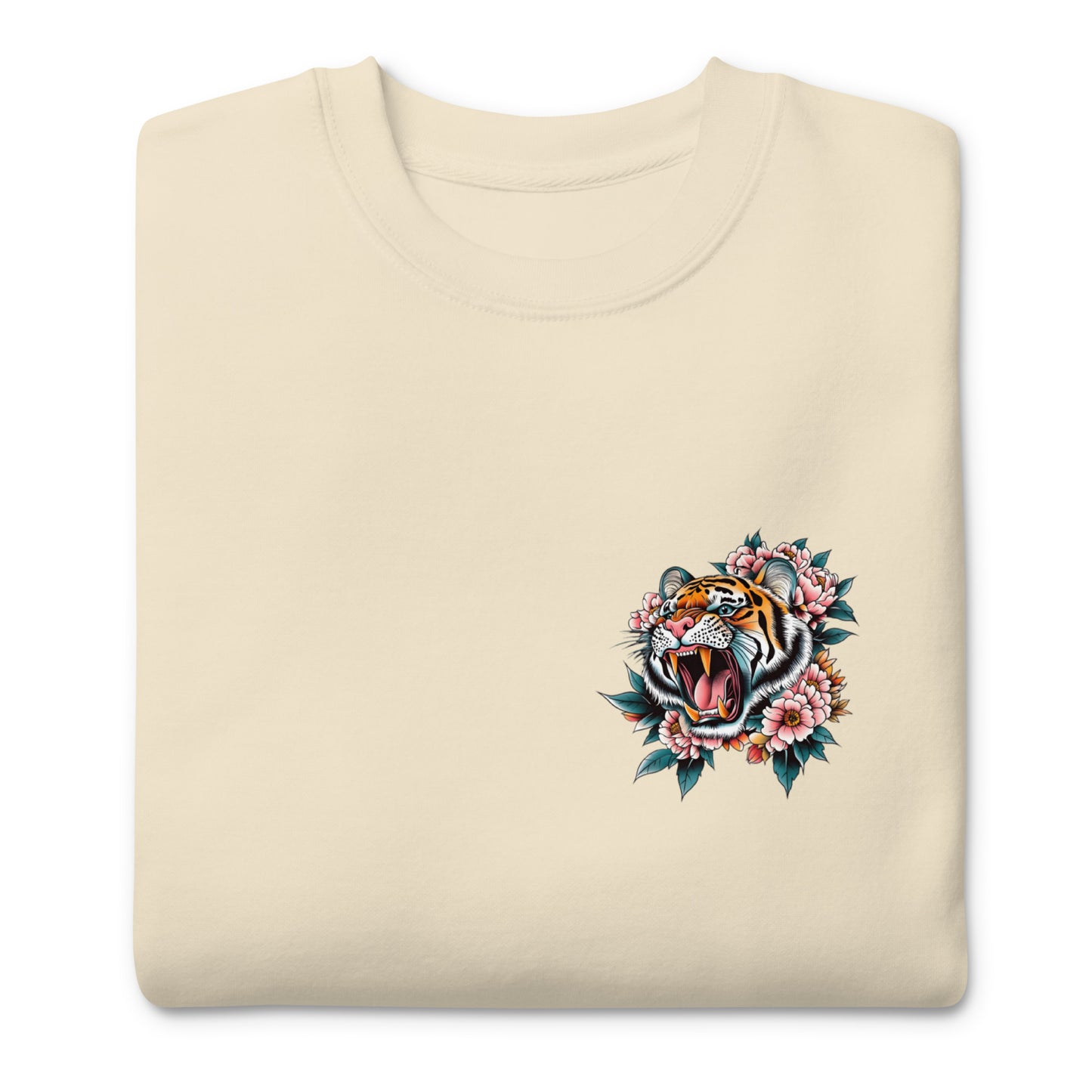 Folded sand unisex premium sweatshirt featuring small tiger emblem on front chest, companion artwork for “Women Don’t Owe You Sh*t” feminist design.