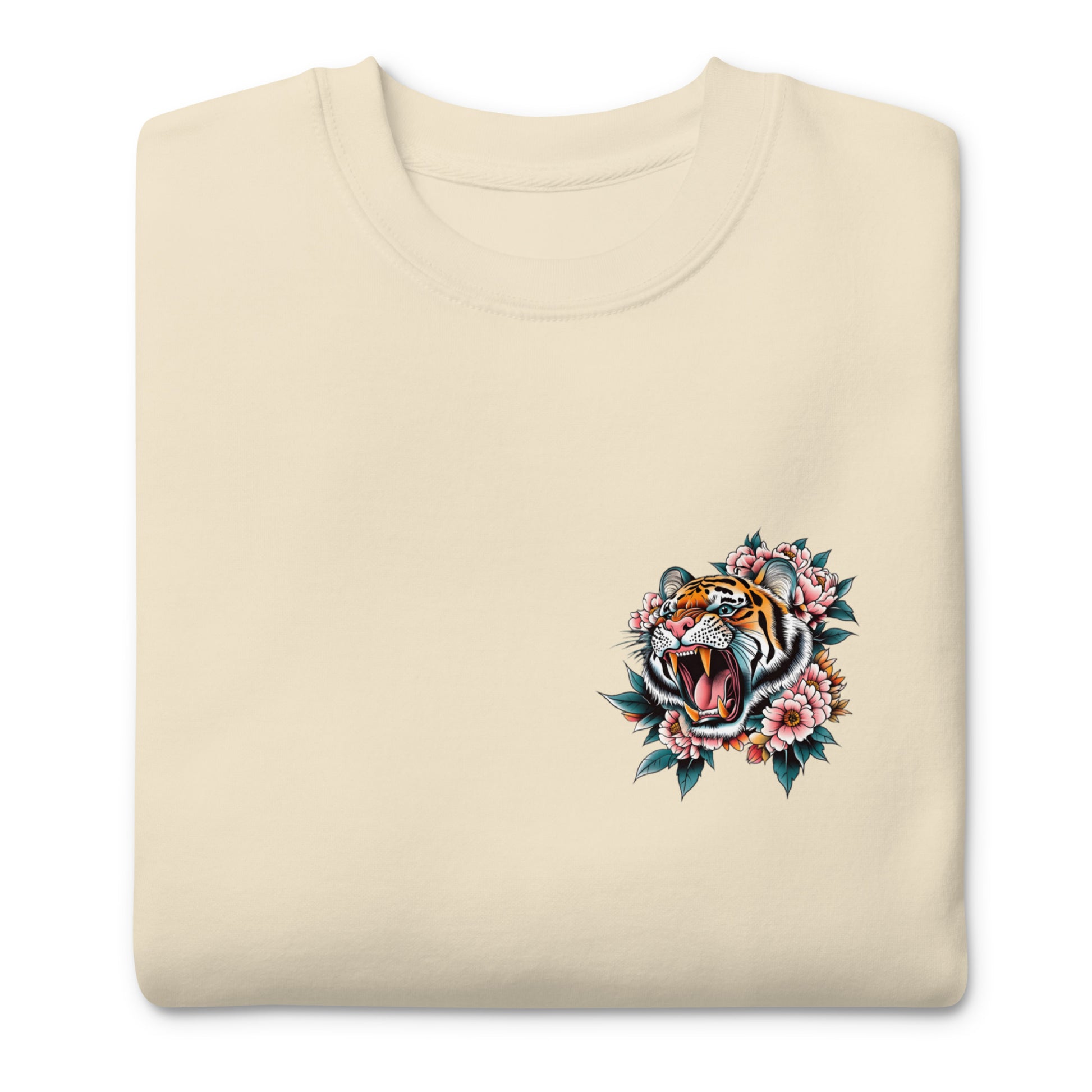 Folded sand unisex premium sweatshirt featuring small tiger emblem on front chest, companion artwork for “Women Don’t Owe You Sh*t” feminist design.