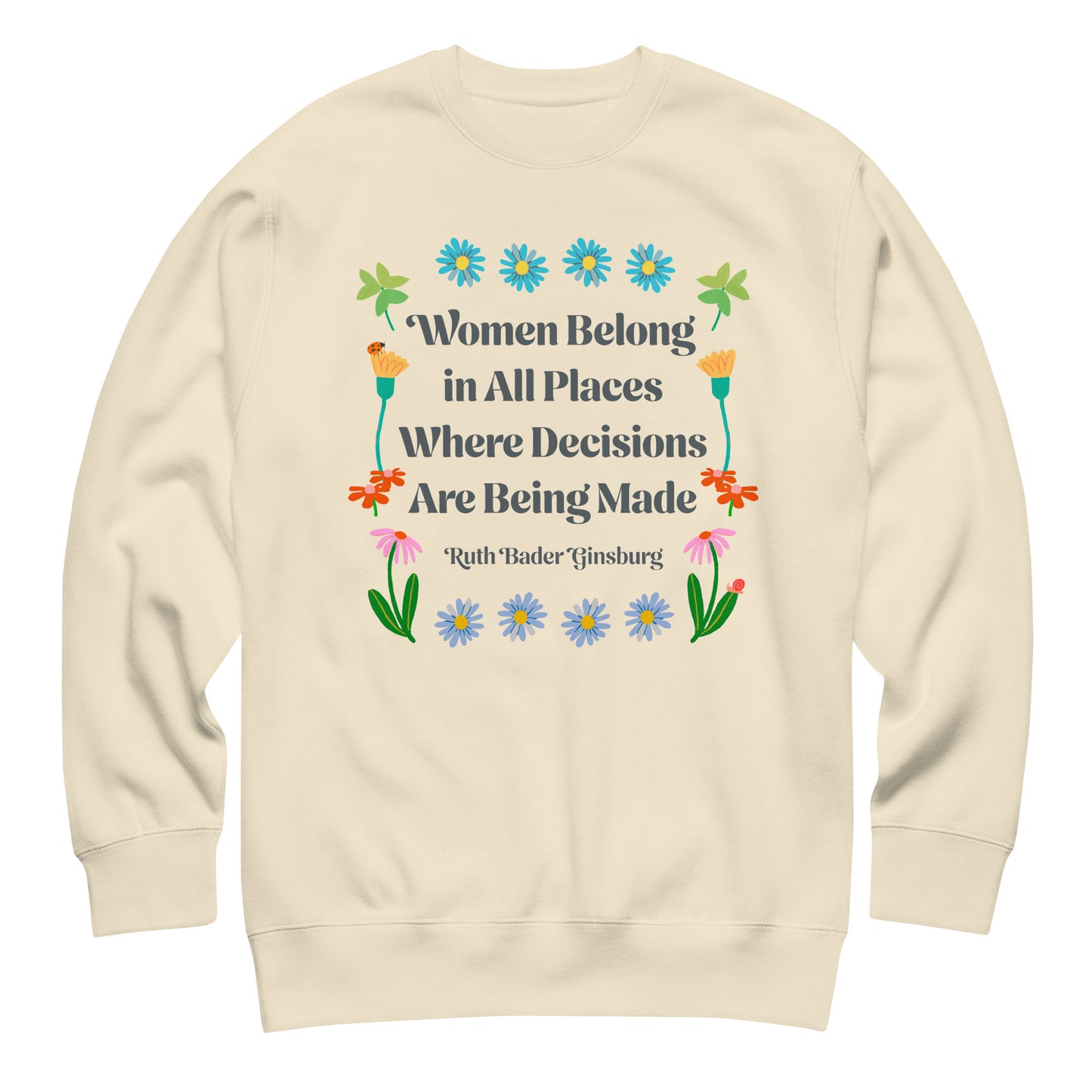 Cream sweatshirt with floral feminist quote design reading “Women Belong in All Places Where Decisions Are Being Made” by Ruth Bader Ginsburg.