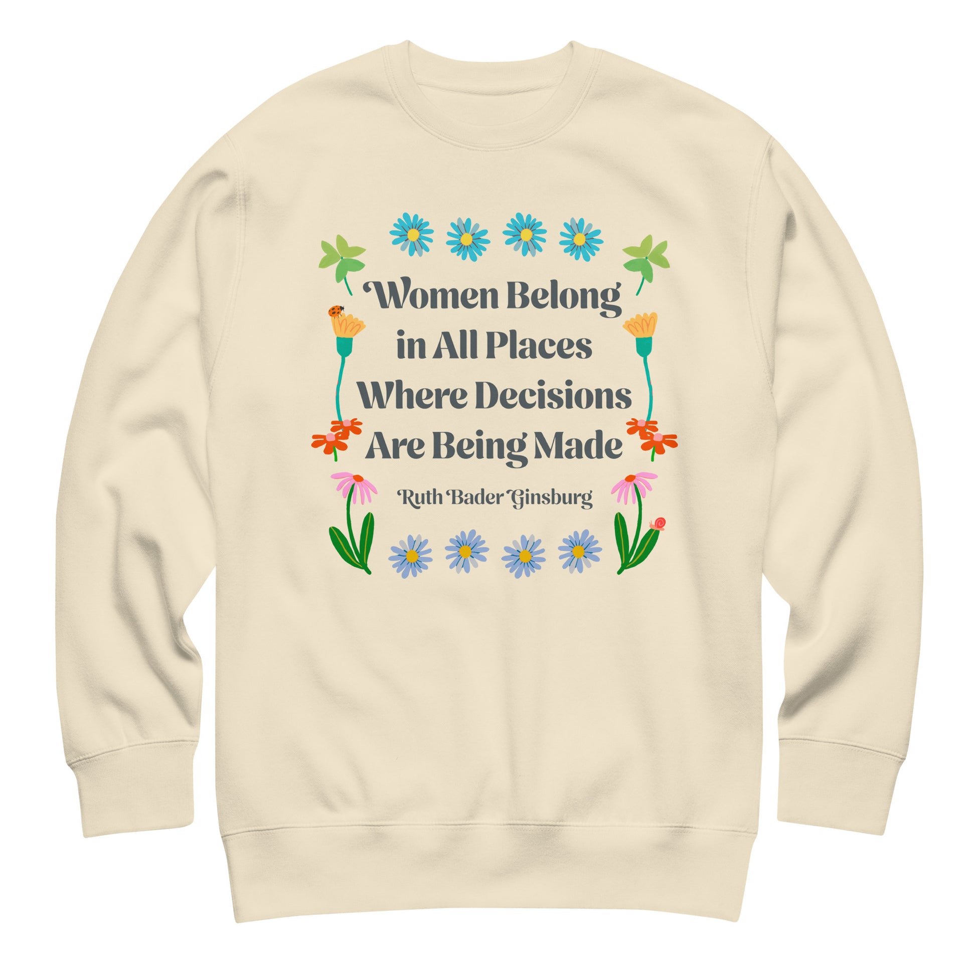 Cream sweatshirt with floral feminist quote design reading “Women Belong in All Places Where Decisions Are Being Made” by Ruth Bader Ginsburg.