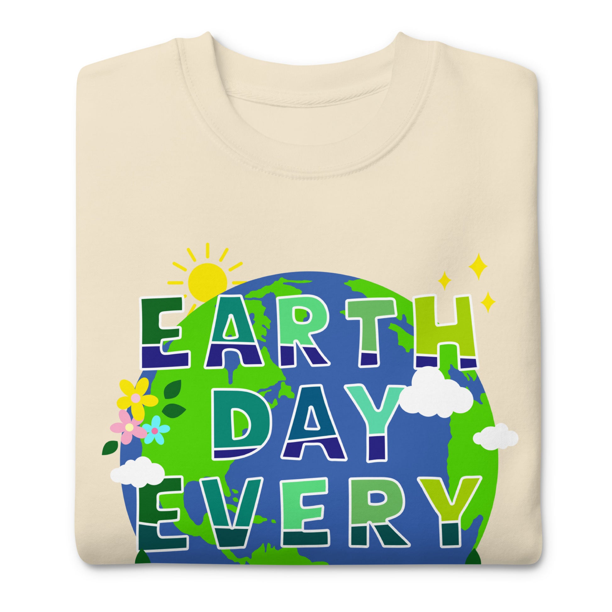 Folded cream sweatshirt displaying globe graphic with flowers and “Earth Day Every Day” phrase in bright environmental awareness style.