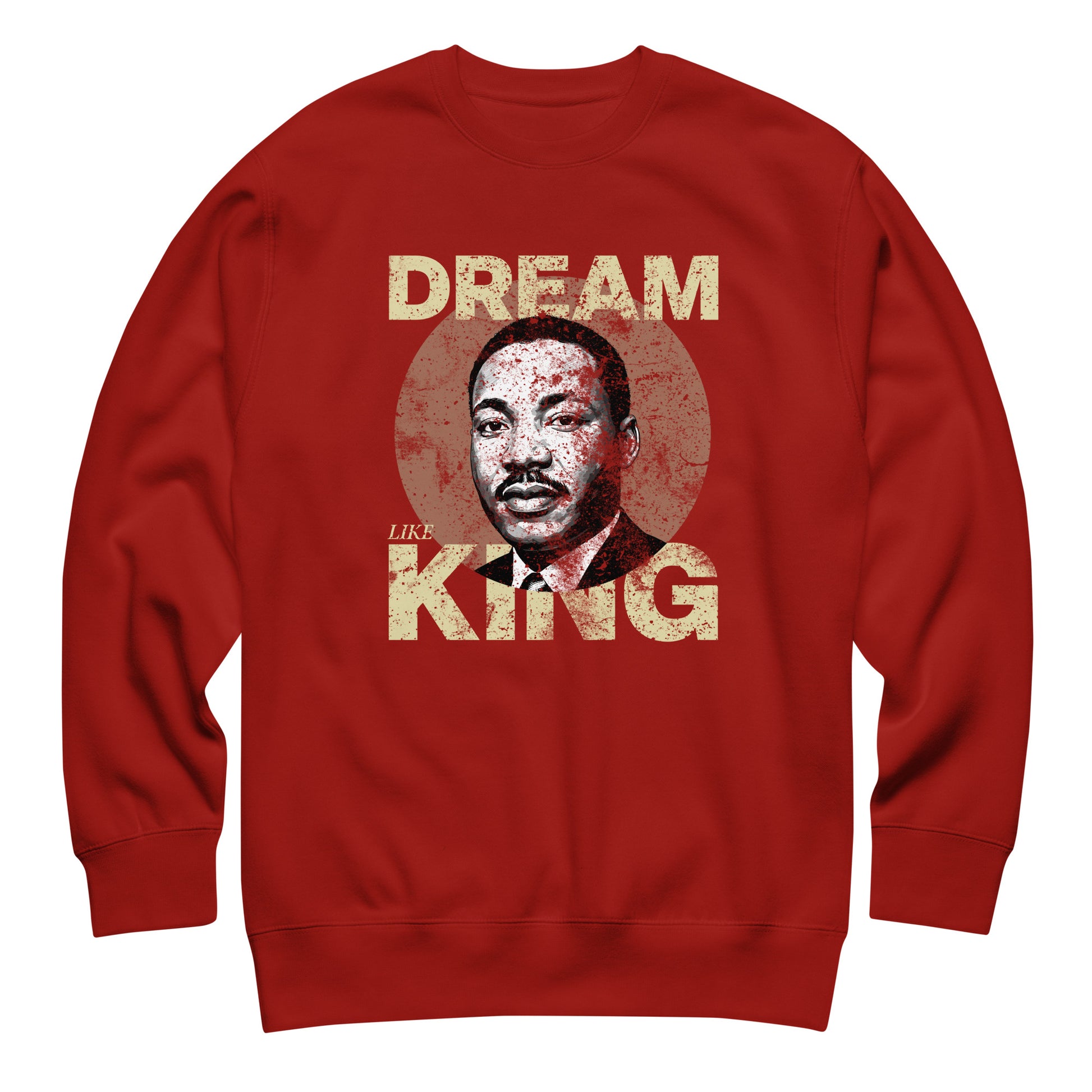 Red unisex premium sweatshirt featuring the distressed “DREAM LIKE KING” lettering alongside MLK’s portrait inside a faded circle. Vintage civil-rights inspired artwork.