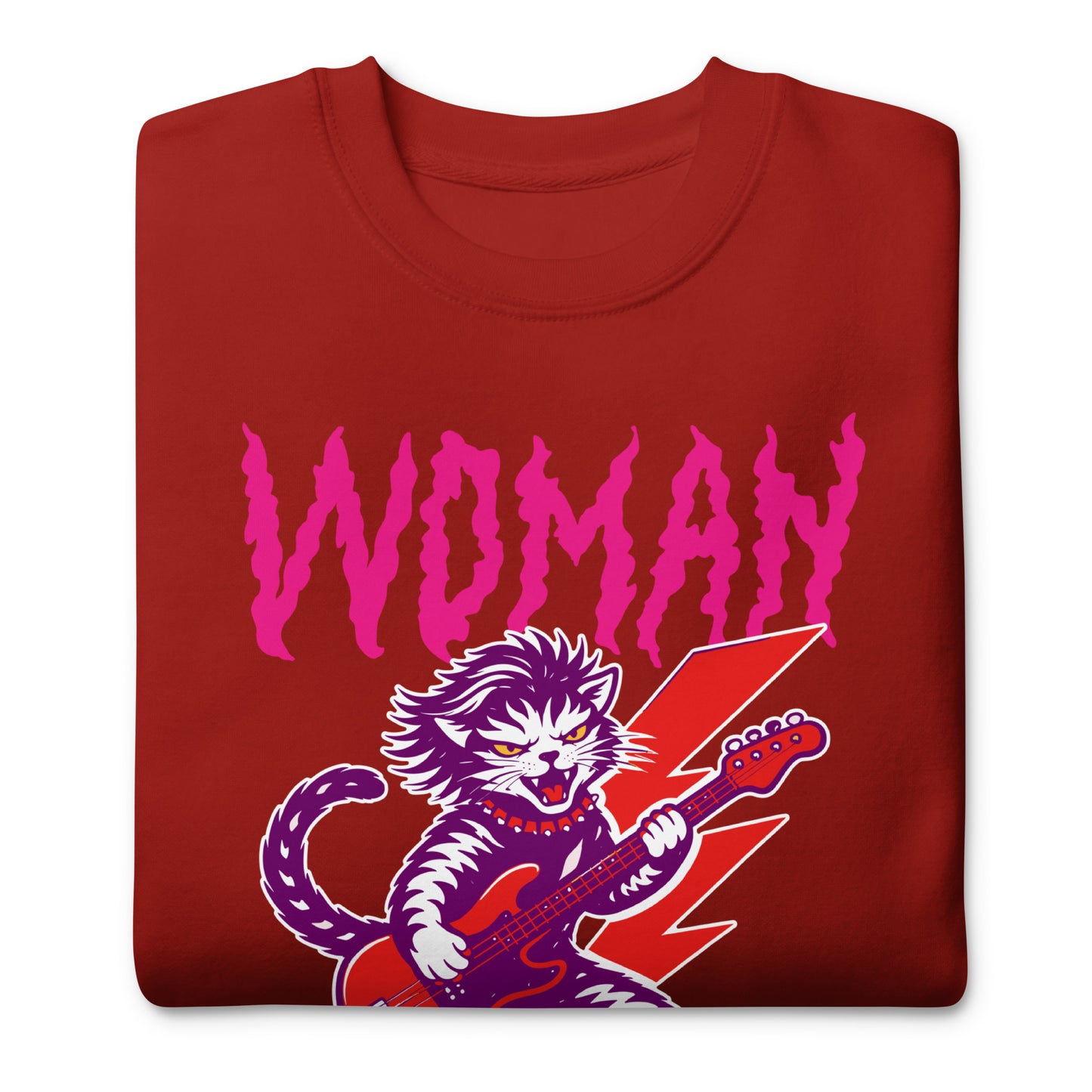 Folded cardinal red unisex premium sweatshirt showing the punk rock cat illustration and bold distressed lettering reading “WOMAN OF A CERTAIN RAGE,” graphic-forward product display.