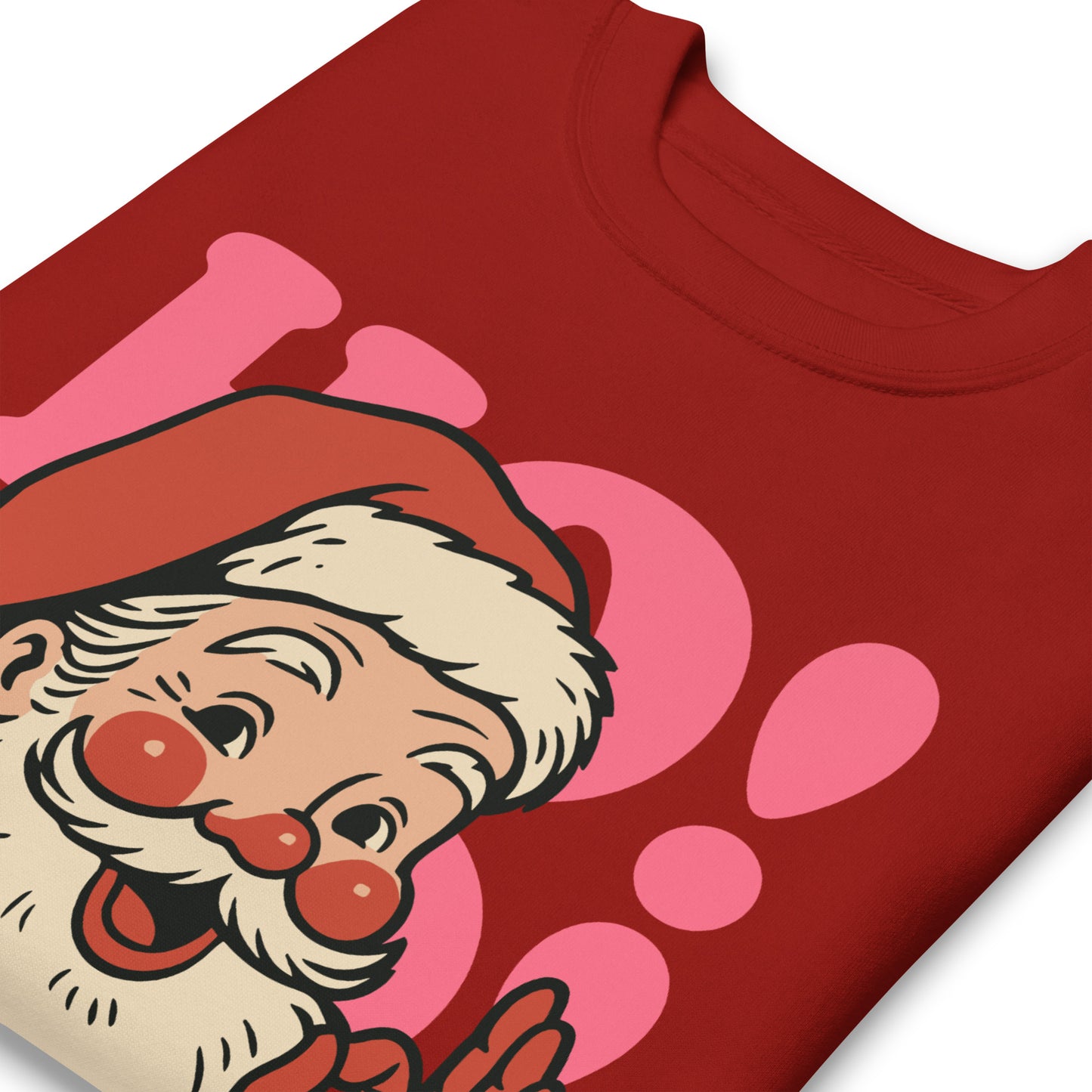 Detail image of the red sweatshirt highlighting the vintage Santa art and the bold pink “HO!” background elements—printed by Blue Wave USA.