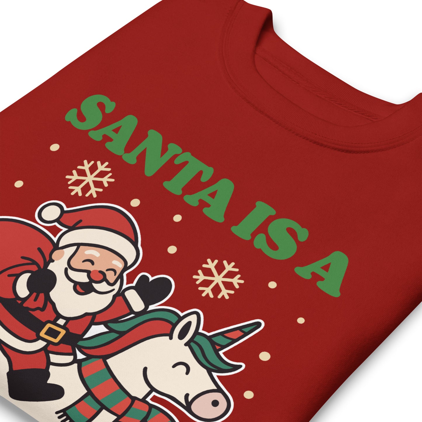 Close-up of a red sweatshirt showing a retro Santa riding a unicorn, holiday stars, and the printed message “SANTA IS A SOCIALIST,” printed apparel by Blue Wave USA.