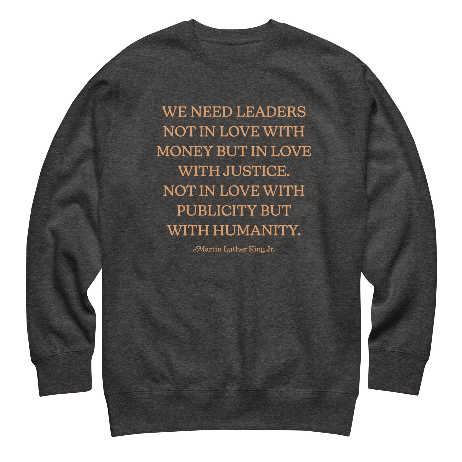 Dark heather gray unisex premium sweatshirt with the MLK quote centered in contrasting text, emphasizing justice-driven leadership and compassion.