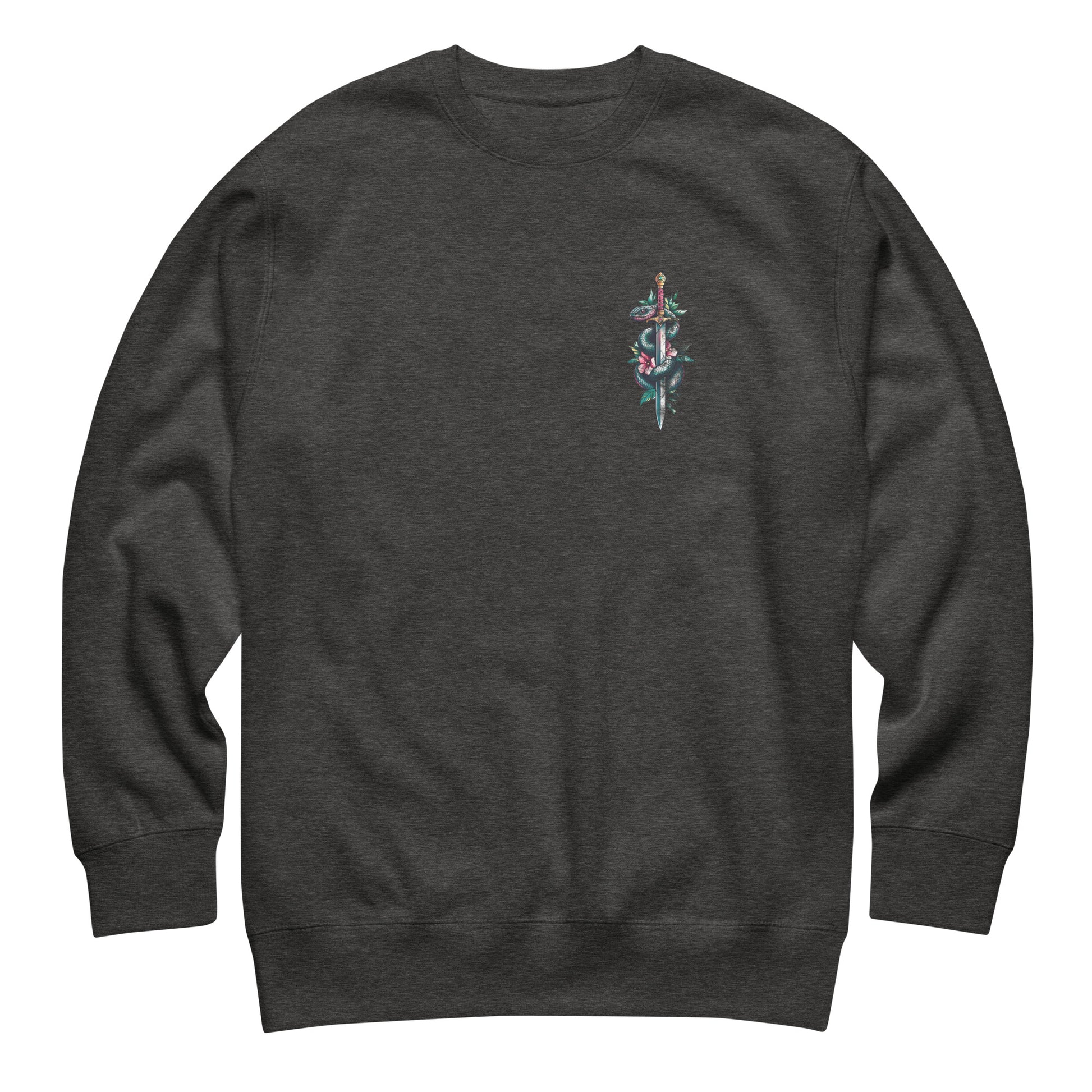 Dark gray unisex premium sweatshirt front featuring small chest snake and dagger illustration with typography reading “Protect Trans Kids.”