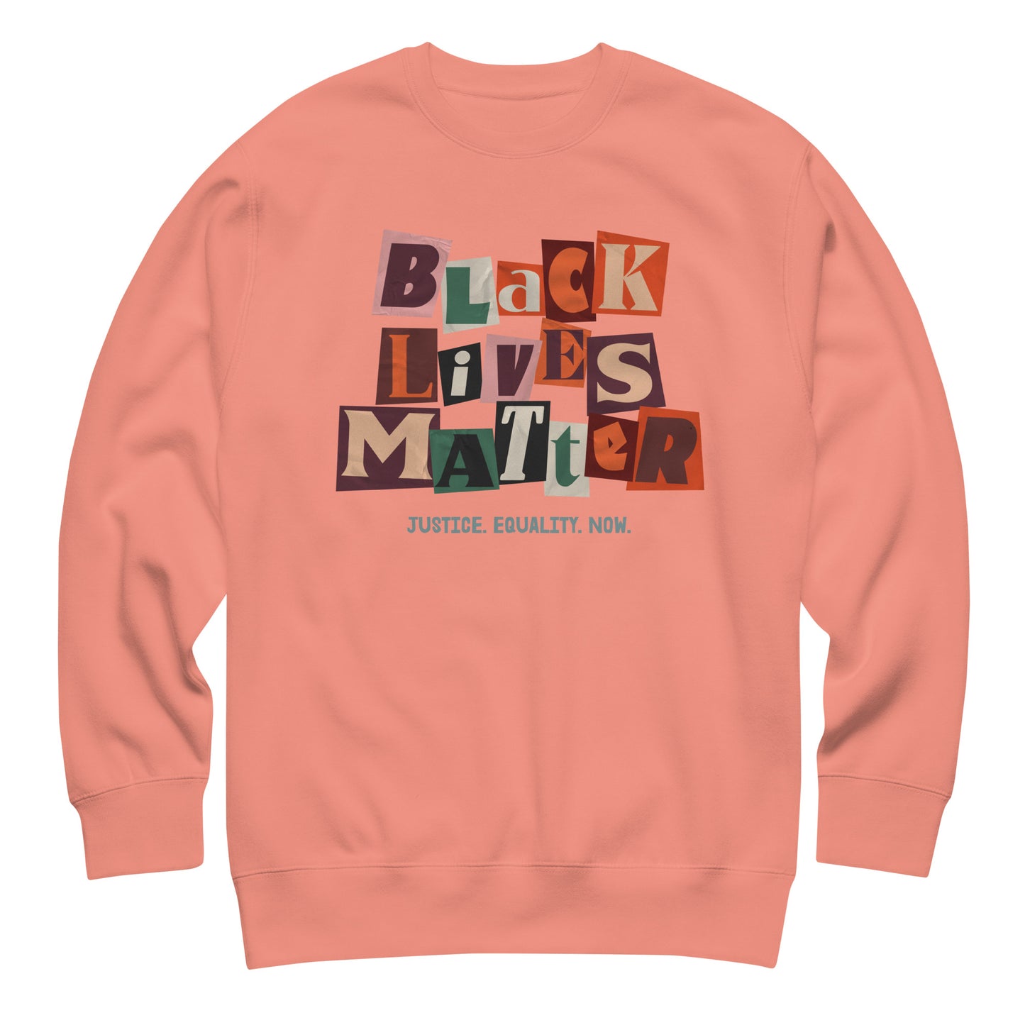 Dusty rose unisex sweatshirt showcasing colorful collage blocks spelling “BLACK LIVES MATTER” with the added “JUSTICE. EQUALITY. NOW.” message, blending warm tones with civil-rights expression.