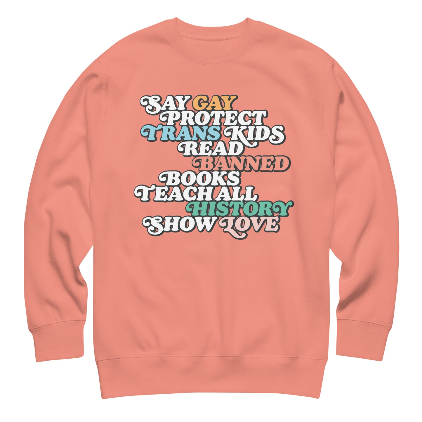 Coral unisex premium sweatshirt featuring retro stacked typography reading “Say Gay Protect Trans Kids Read Banned Books Teach All History Show Love,” progressive graphic sweatshirt by Blue Wave USA.