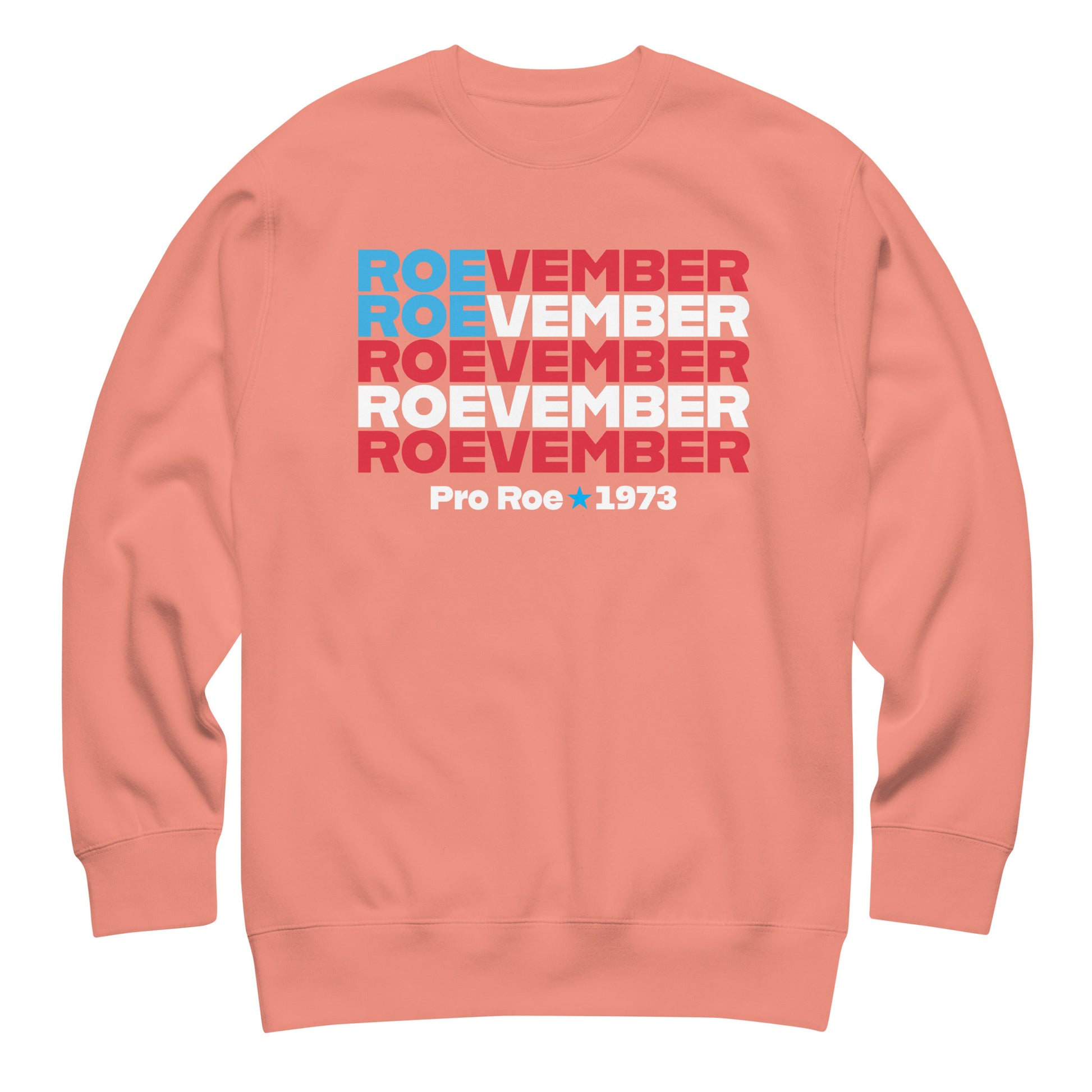 Peach unisex premium sweatshirt featuring stacked red, white, and blue typography reading “Roevember Pro Roe 1973,” pro-choice apparel from Blue Wave USA.