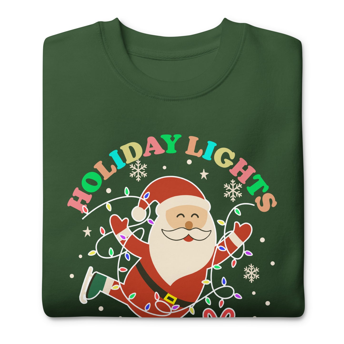 A folded green unisex sweatshirt displaying Santa with colorful holiday lights, stars, snowflakes, and gifts surrounding the message “HOLIDAY LIGHTS ABOLISH ICE,” designed for festive activist celebrations.