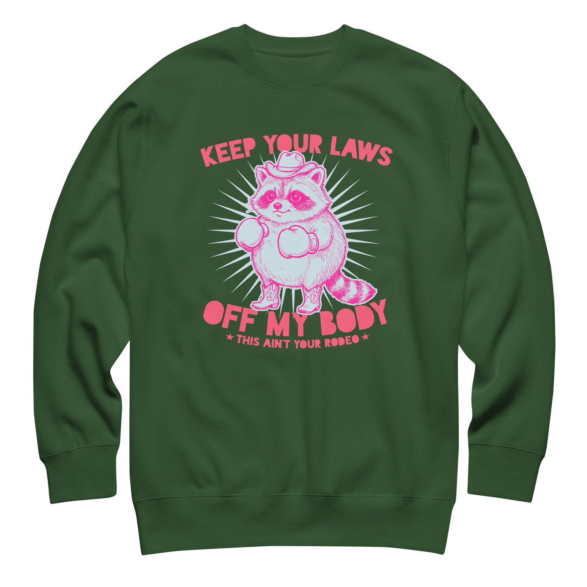 Forest green unisex sweatshirt featuring cowboy raccoon artwork and reproductive rights message in bold feminist protest design.