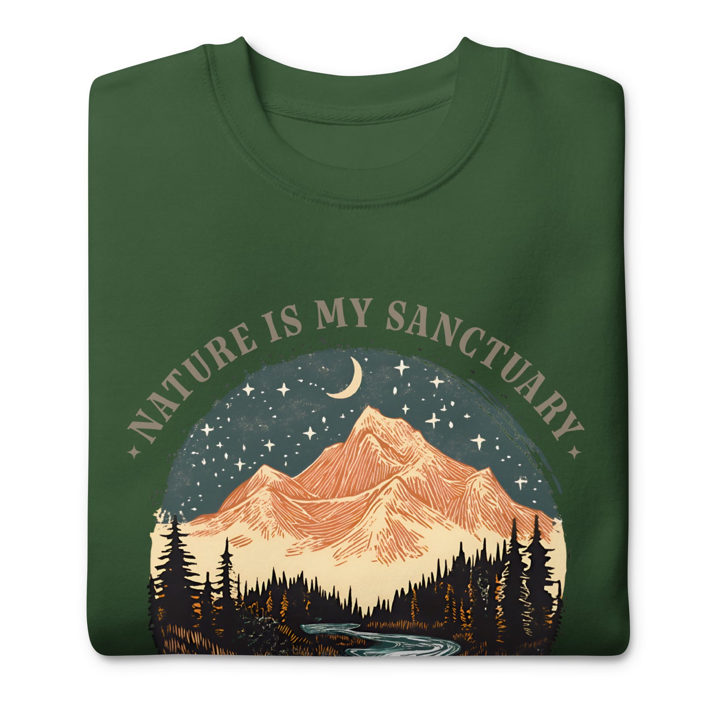 Folded forest green sweatshirt displaying vintage mountain and river illustration with “Nature Is My Sanctuary” wording in calm nature-inspired apparel style.