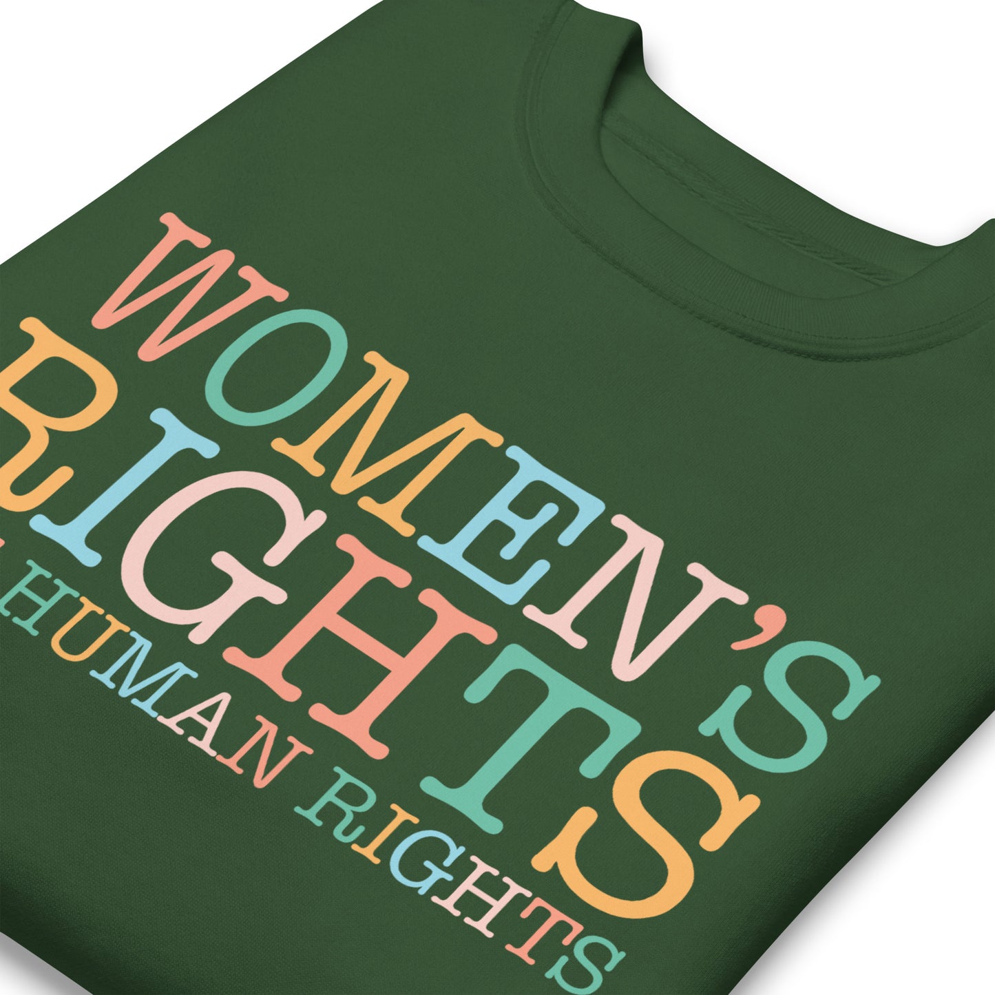 Green unisex premium sweatshirt close-up featuring layered pastel typography reading “Women’s Rights Are Human Rights,” feminist statement apparel.