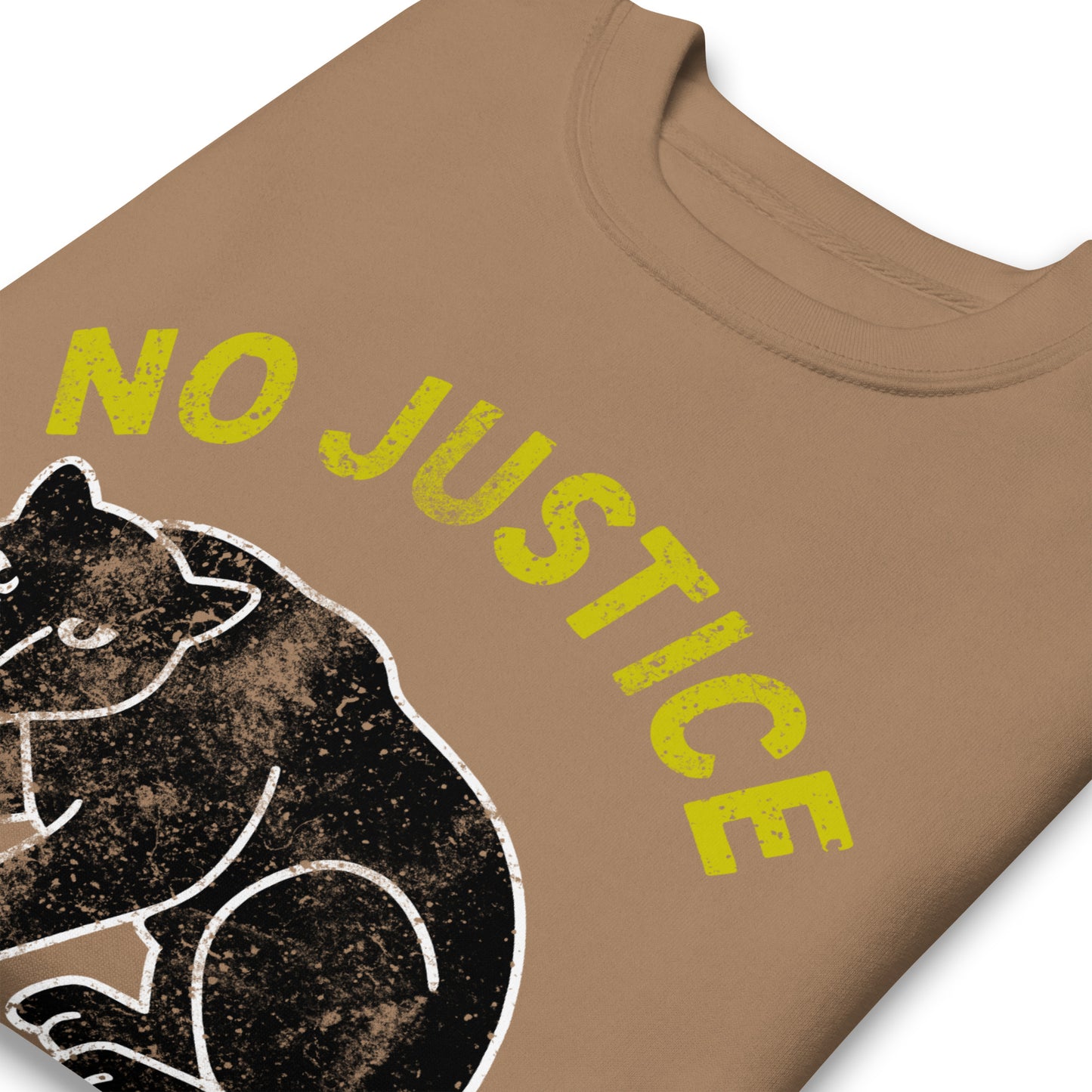 Close-up of a latte color unisex sweatshirt highlighting “NO JUSTICE NO PEACE” lettering and the distressed panther illustration. Activist apparel emphasizing textured, justice-driven design.