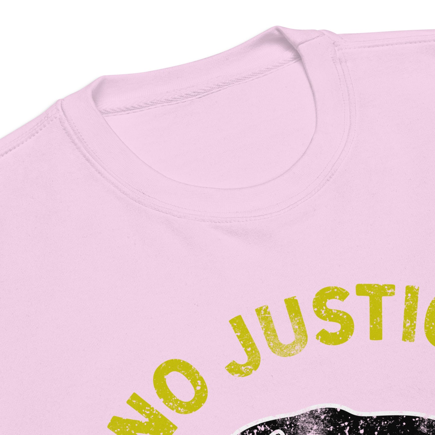 Folded pink unisex sweatshirt with “NO JUSTICE NO PEACE” and partial panther illustration visible. Progressive apparel featuring soft colors and justice-focused artwork.