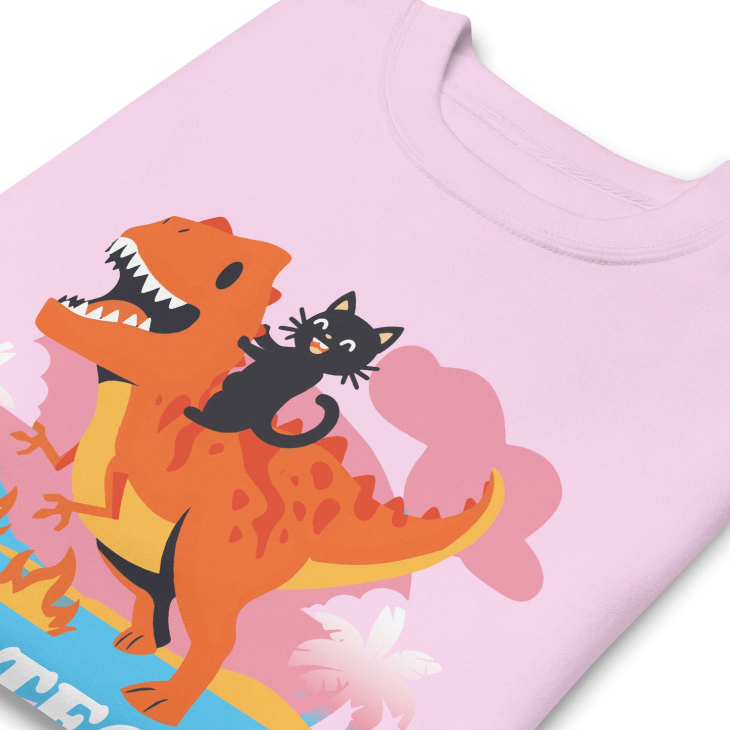 Lavender premium sweatshirt close-up showing cartoon dinosaur and ally cat illustration with pastel landscape above bold retro typography reading “Protect Trans Kids.”