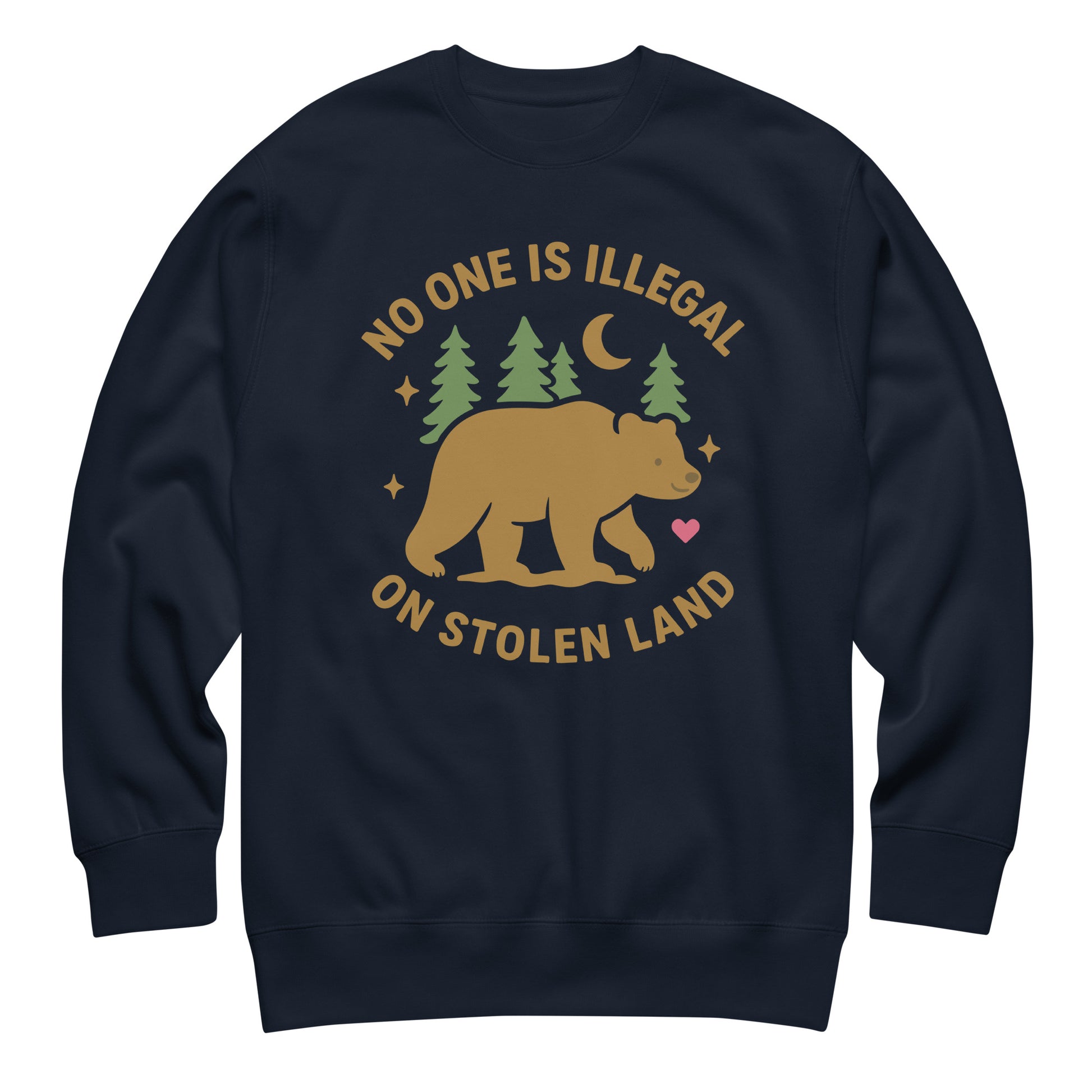Navy unisex premium sweatshirt printed with a tan bear, pine trees, moon, and stars alongside the message “NO ONE IS ILLEGAL ON STOLEN LAND,” designed with soft natural colors.