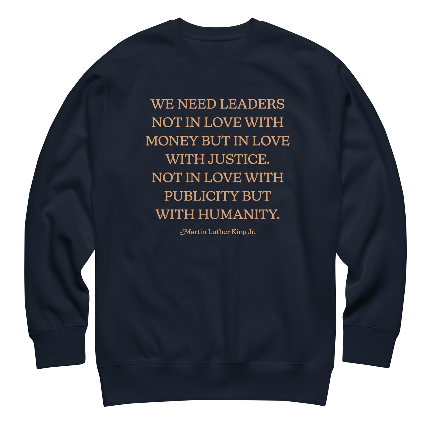 Navy unisex premium sweatshirt featuring the MLK quote in warm serif text. A thoughtful Blue Wave USA civil-rights design for everyday advocacy.
