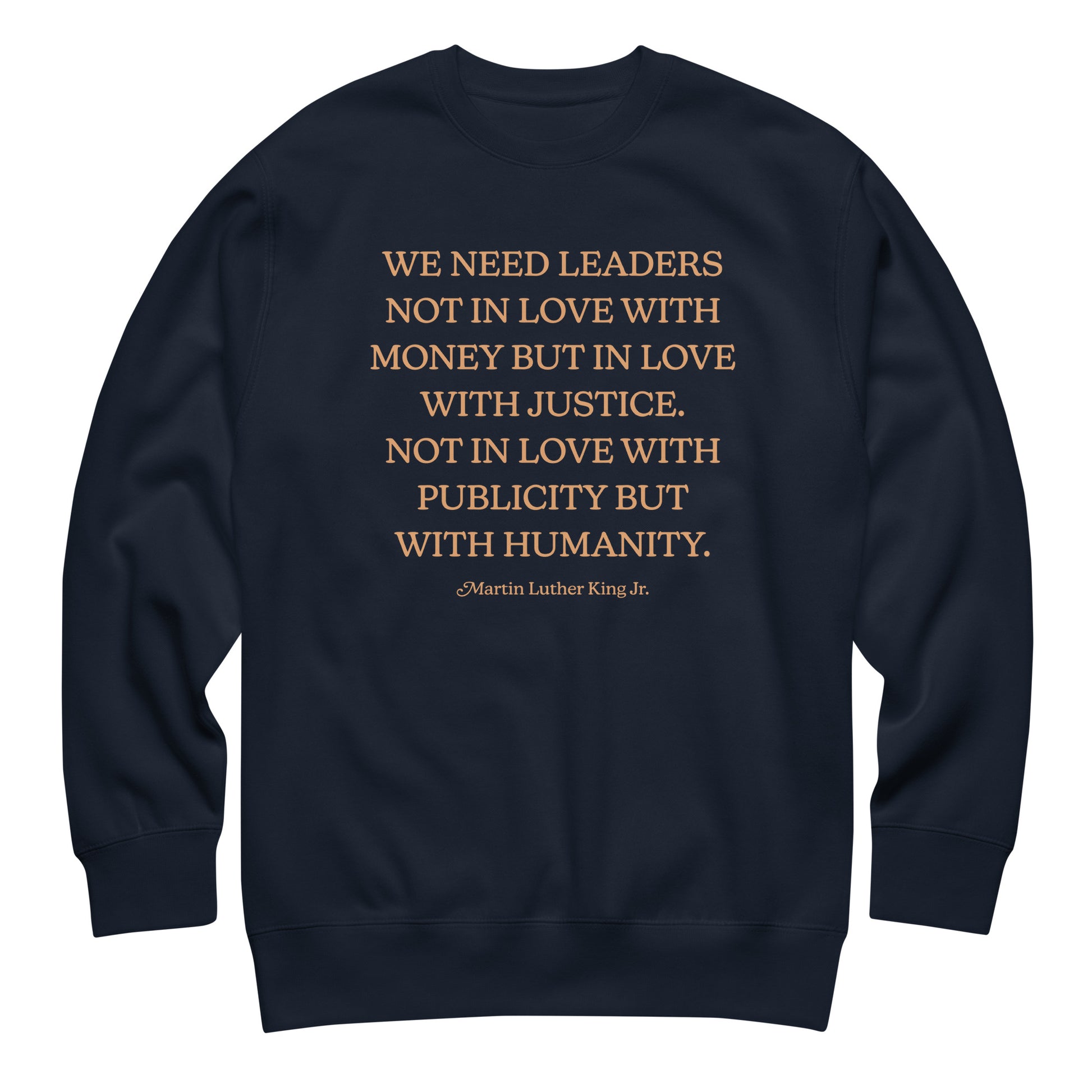 Navy unisex premium sweatshirt featuring the MLK quote in warm serif text. A thoughtful Blue Wave USA civil-rights design for everyday advocacy.