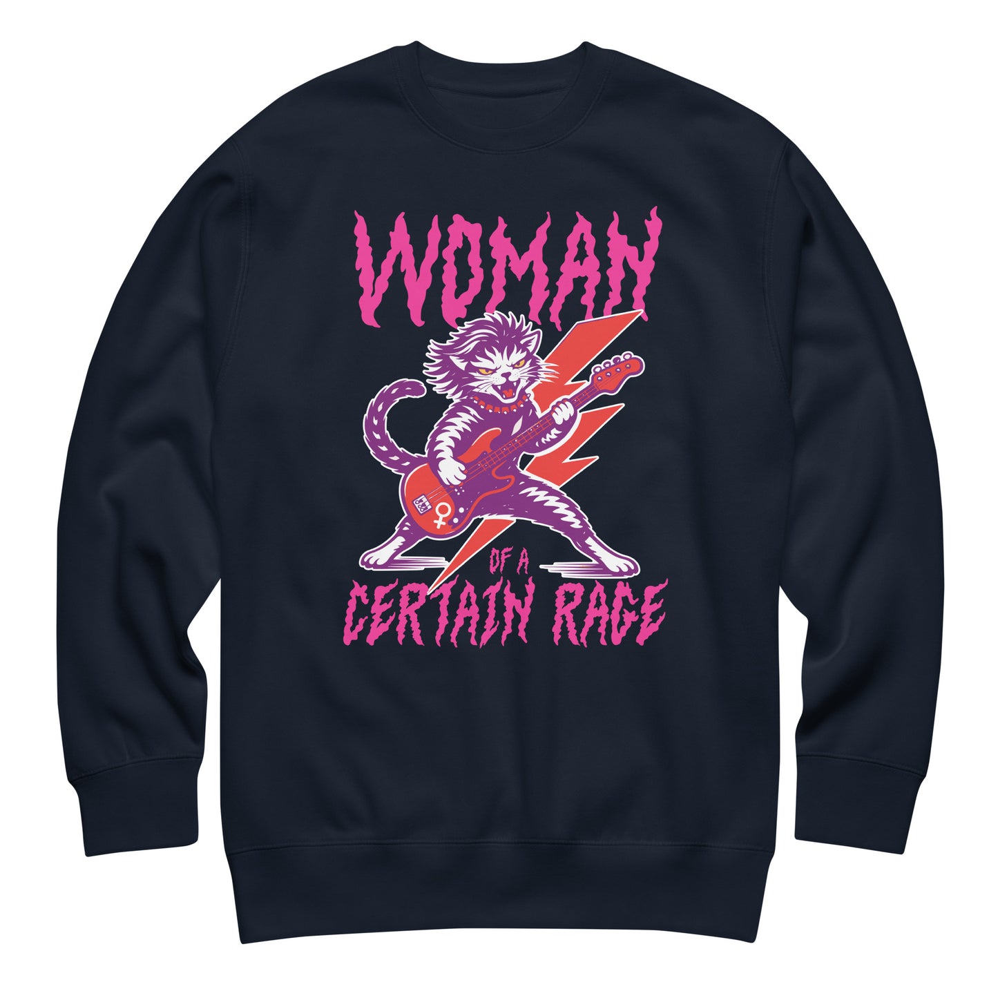 Navy unisex premium sweatshirt displayed flat, featuring a feminist punk rock cat playing electric guitar with distressed lettering reading “WOMAN OF A CERTAIN RAGE,” centered design.