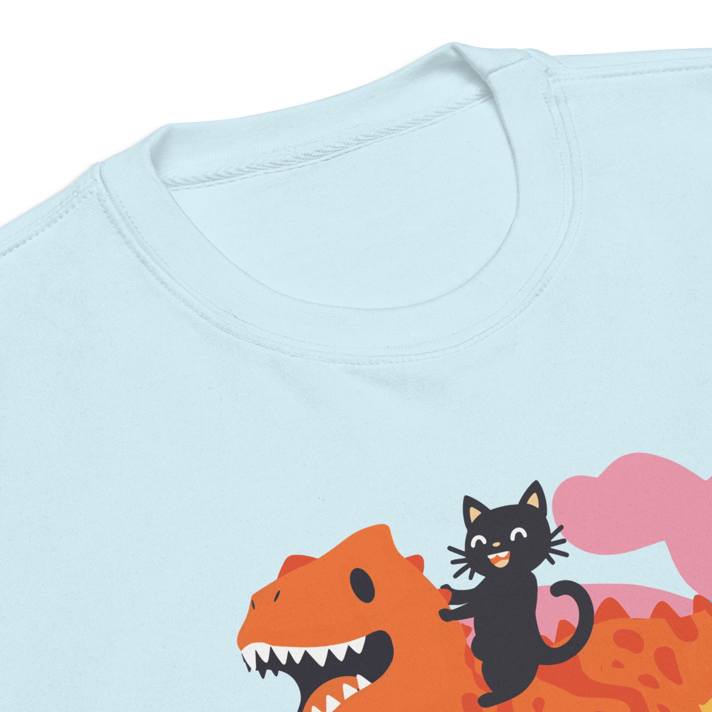 Sky blue unisex premium sweatshirt close-up featuring dinosaur and ally cat illustration with pastel clouds above bold retro typography reading “Protect Trans Kids.”