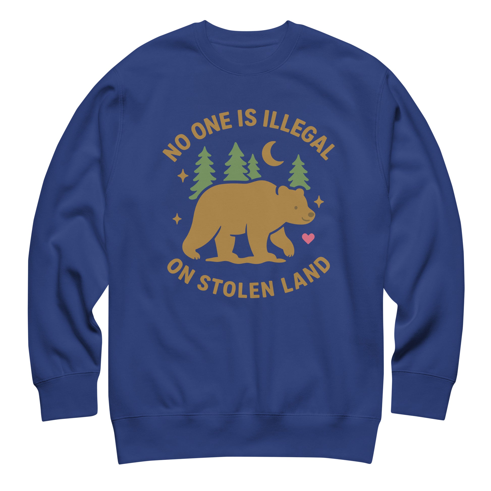 Royal blue unisex premium sweatshirt showing the tan bear, pine trees, moon, and heart beneath the message “NO ONE IS ILLEGAL ON STOLEN LAND,” printed in warm outdoor-inspired tones.