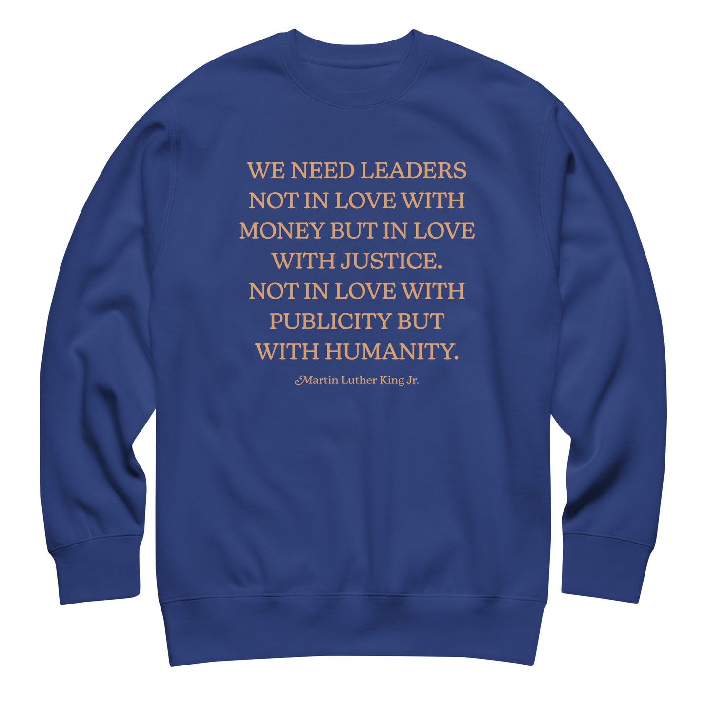 Royal blue unisex premium sweatshirt showing the full MLK quote about justice, humanity, and moral responsibility. Clean design with balanced typography.